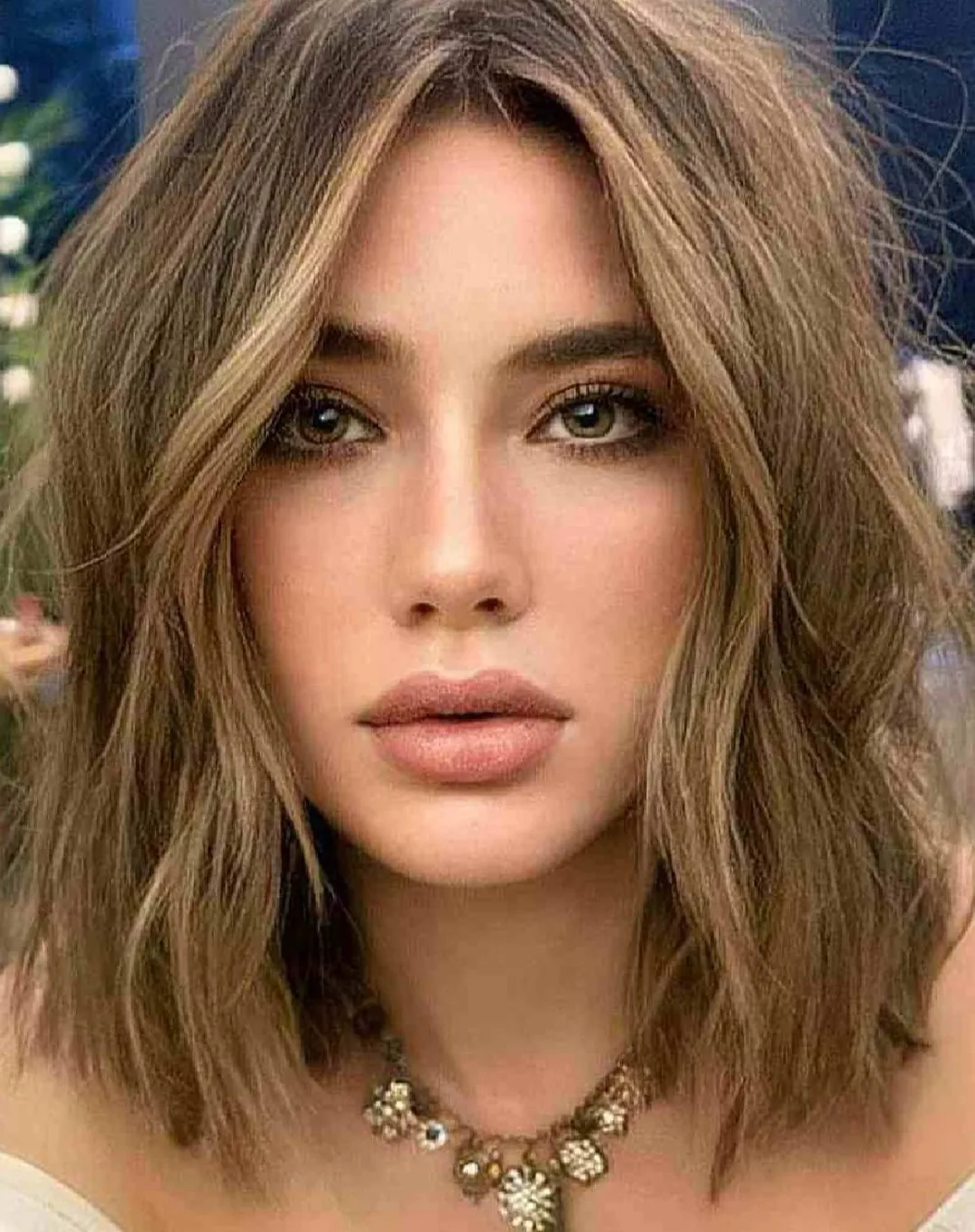 Feathered center-part lob with soft layered ends