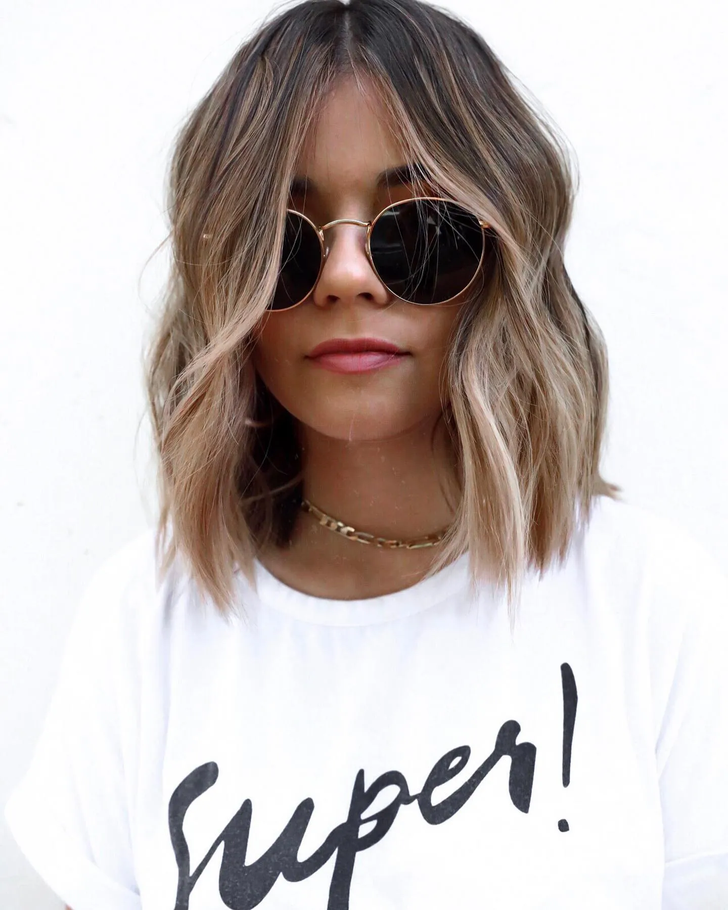 Center-part wavy lob with soft shoulder-length bends
