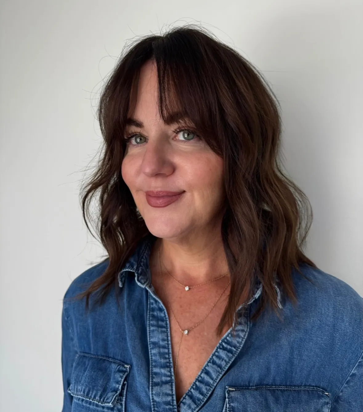 Dark lob with curtain bangs and soft waves