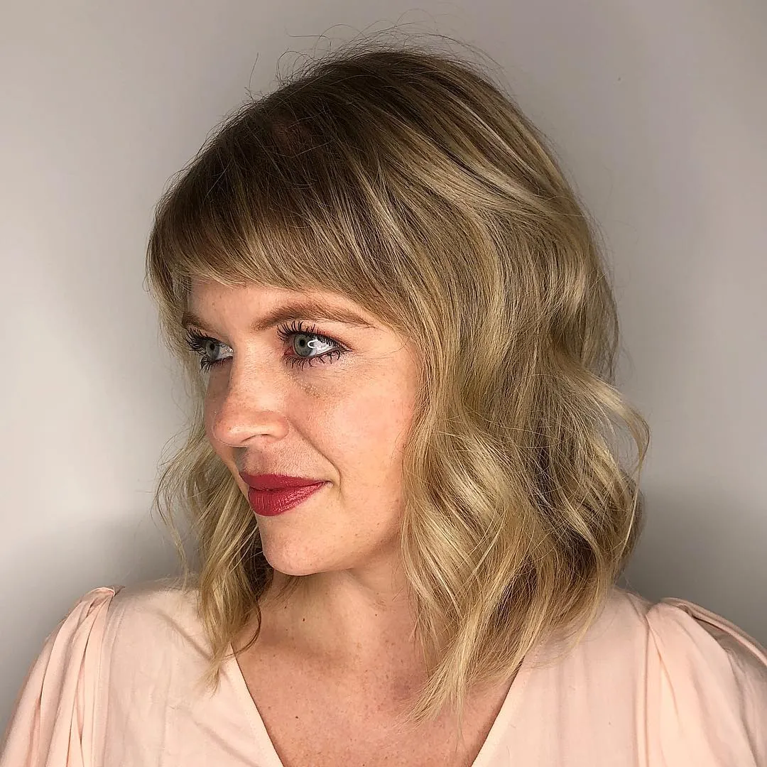 Side-swept wavy lob with soft fringe
