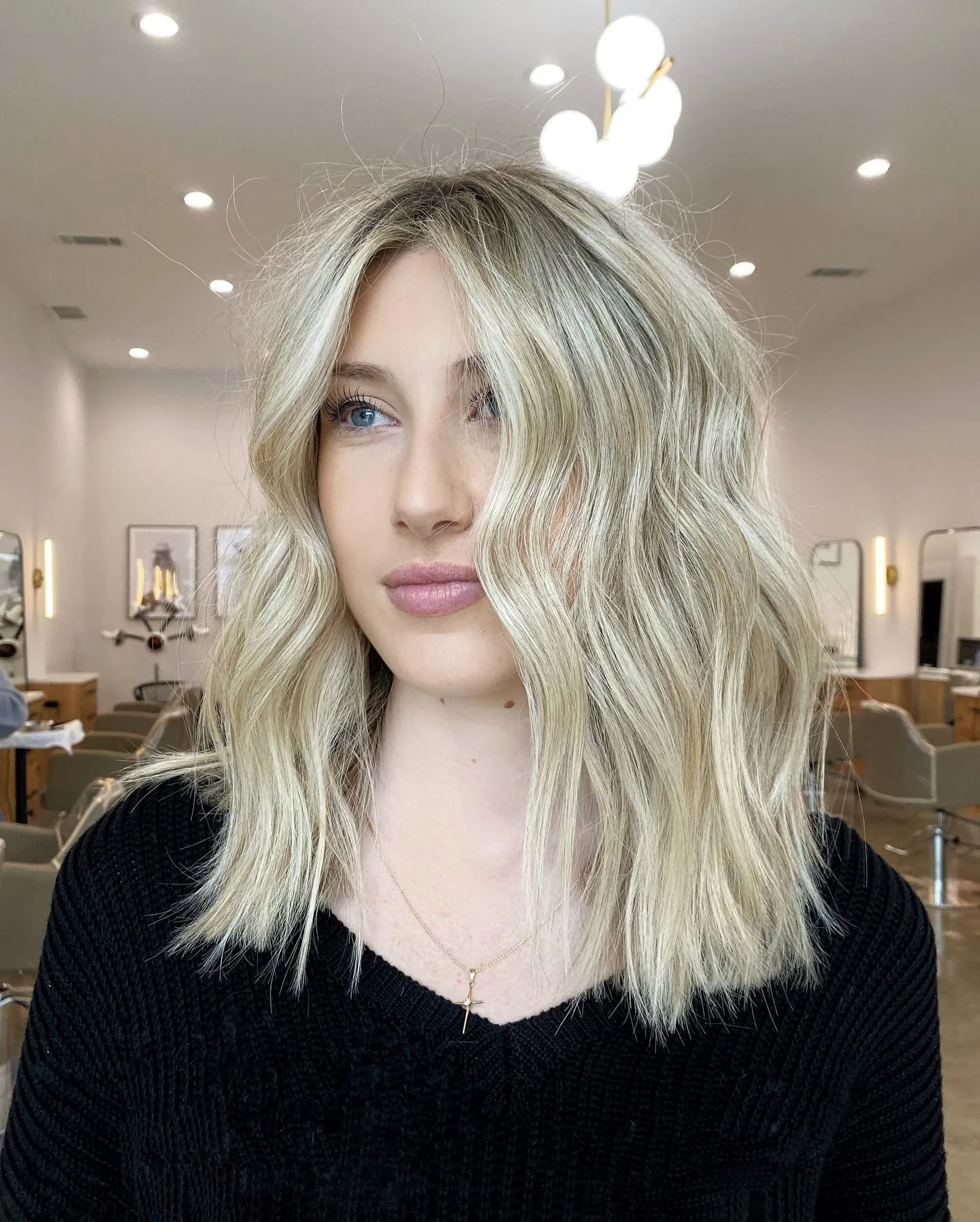 Airy blonde lob with loose waves and soft volume