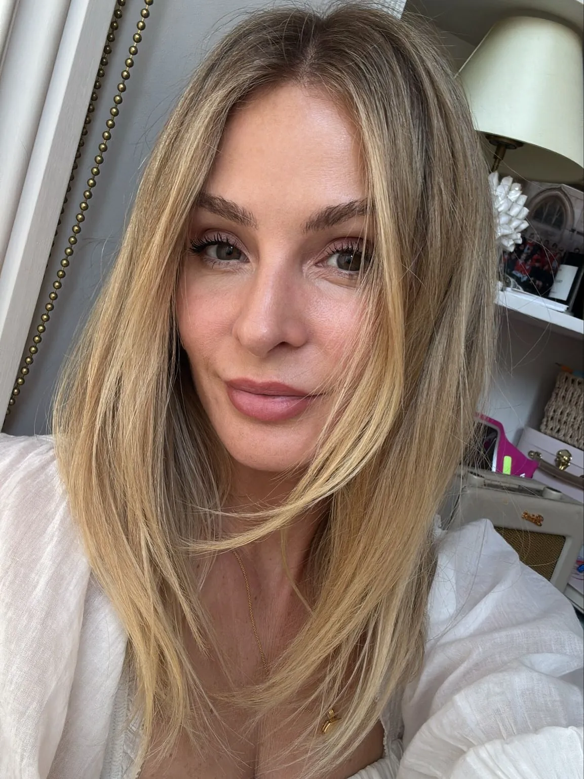 Long straight suede blonde layers with soft root depth