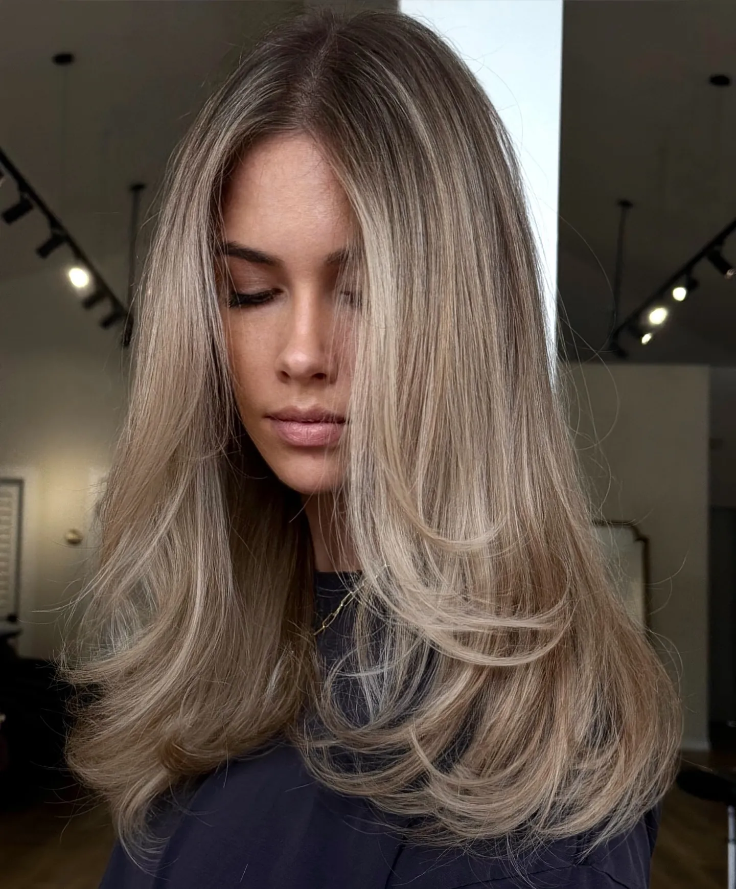 Ashy suede blonde hair with rounded long layers