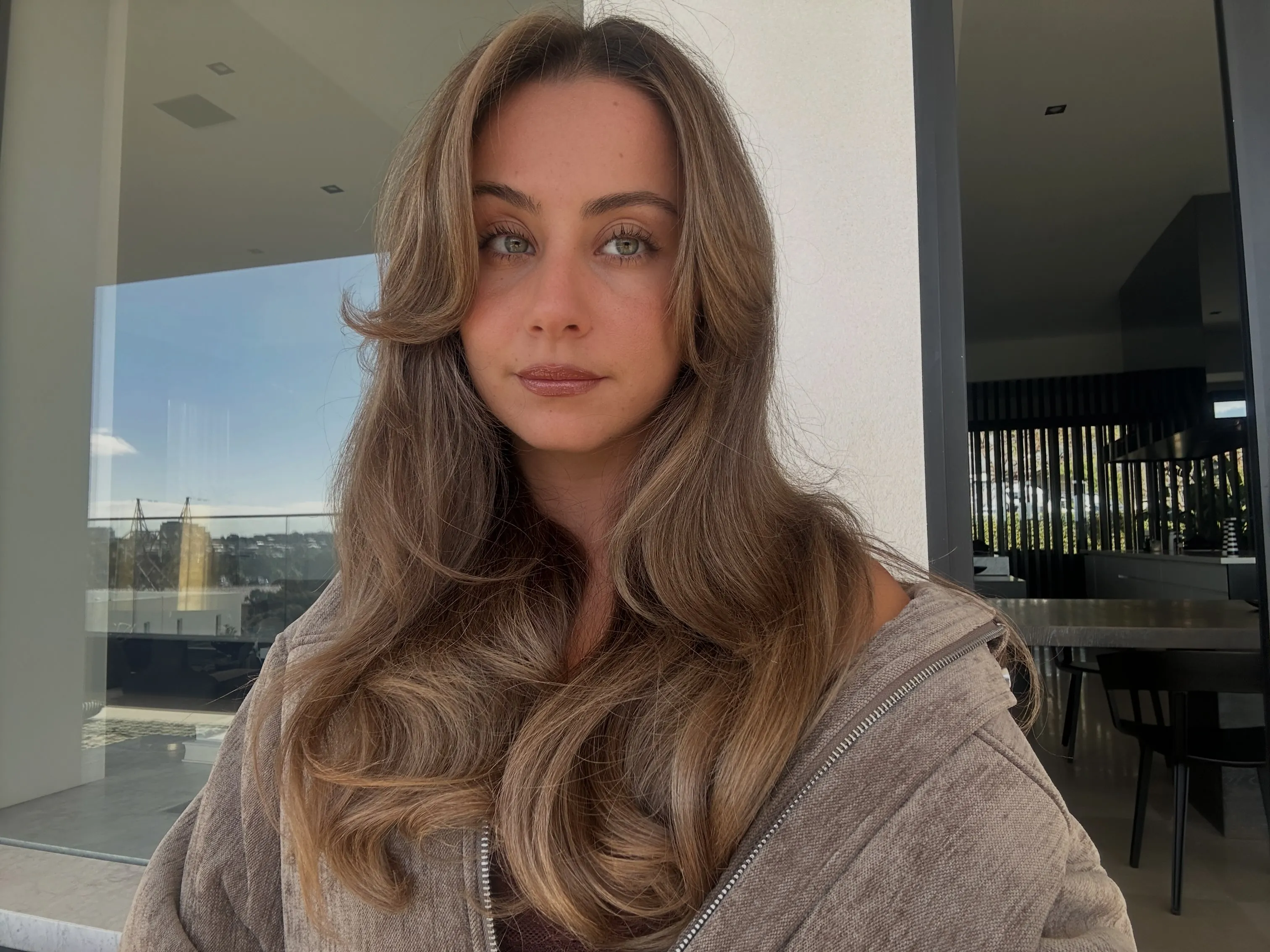 Long suede blonde blowout with volume and deep root shadow