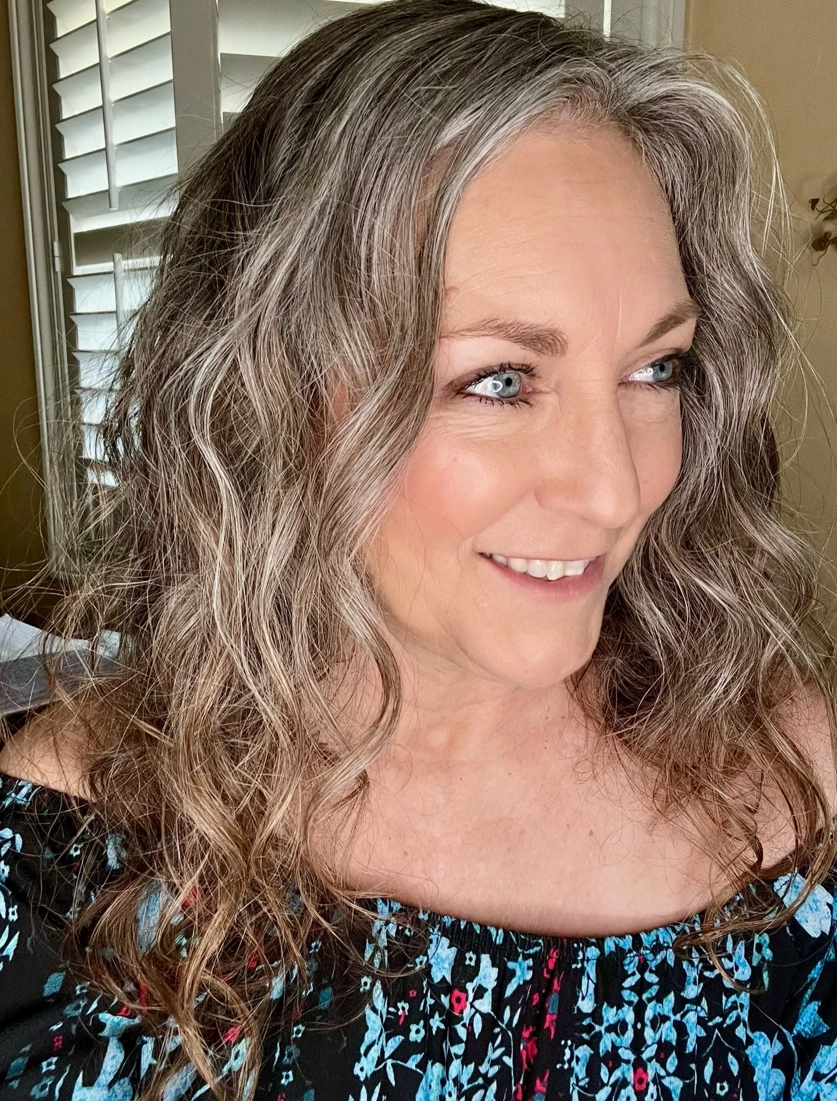 Long natural gray-brown waves with a side part