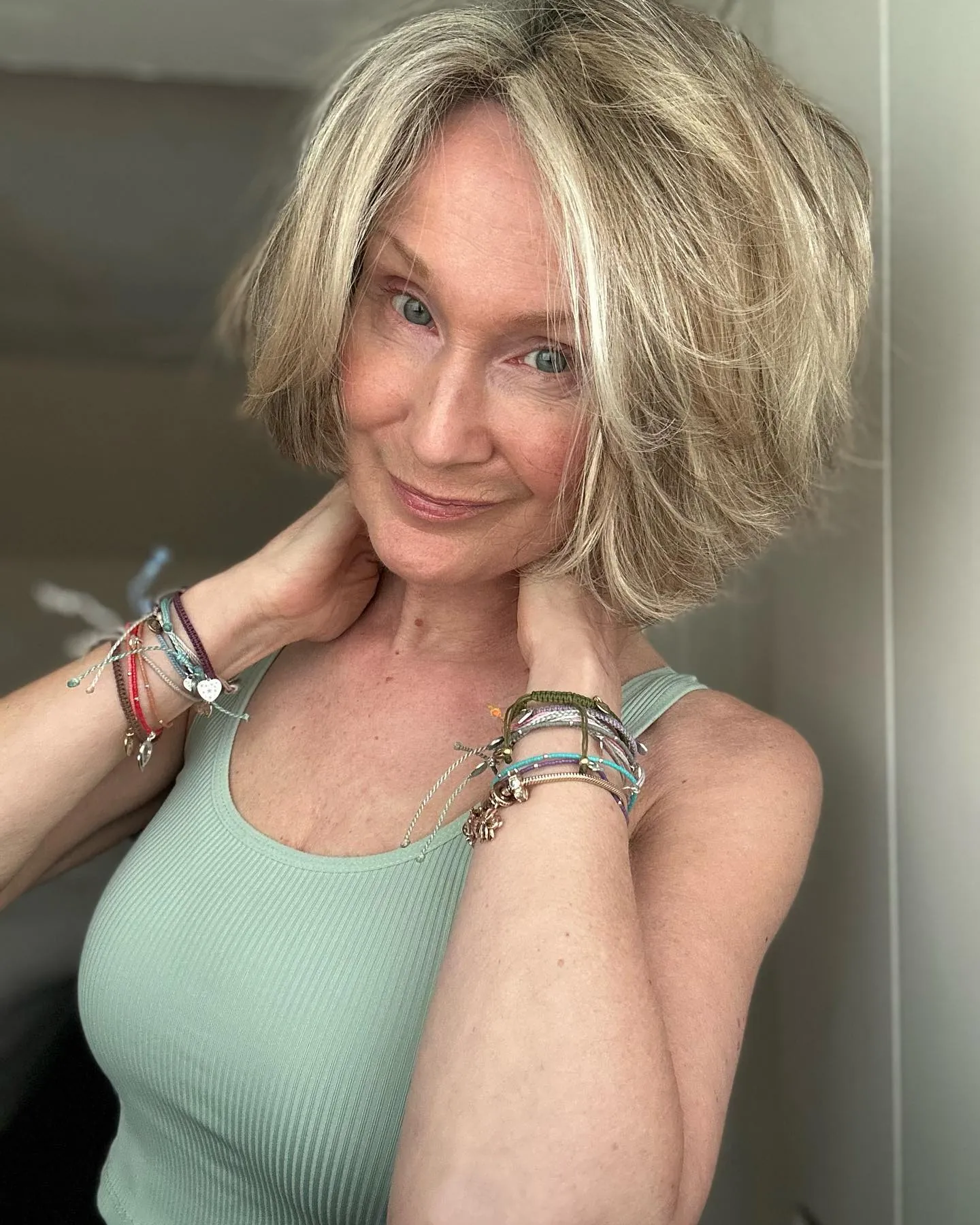 Layered chin-length blonde bob with airy volume