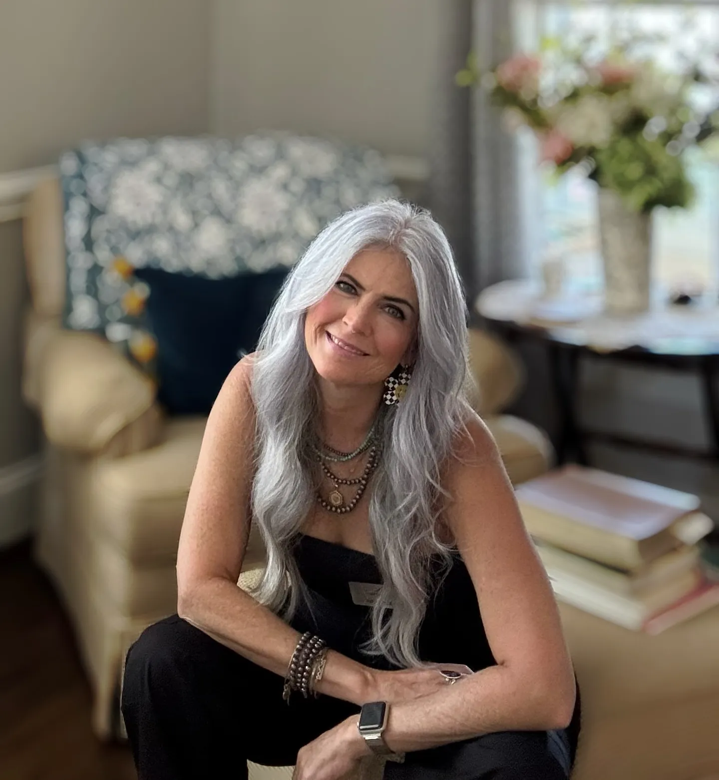 Long silver hair with subtle layers and a side part