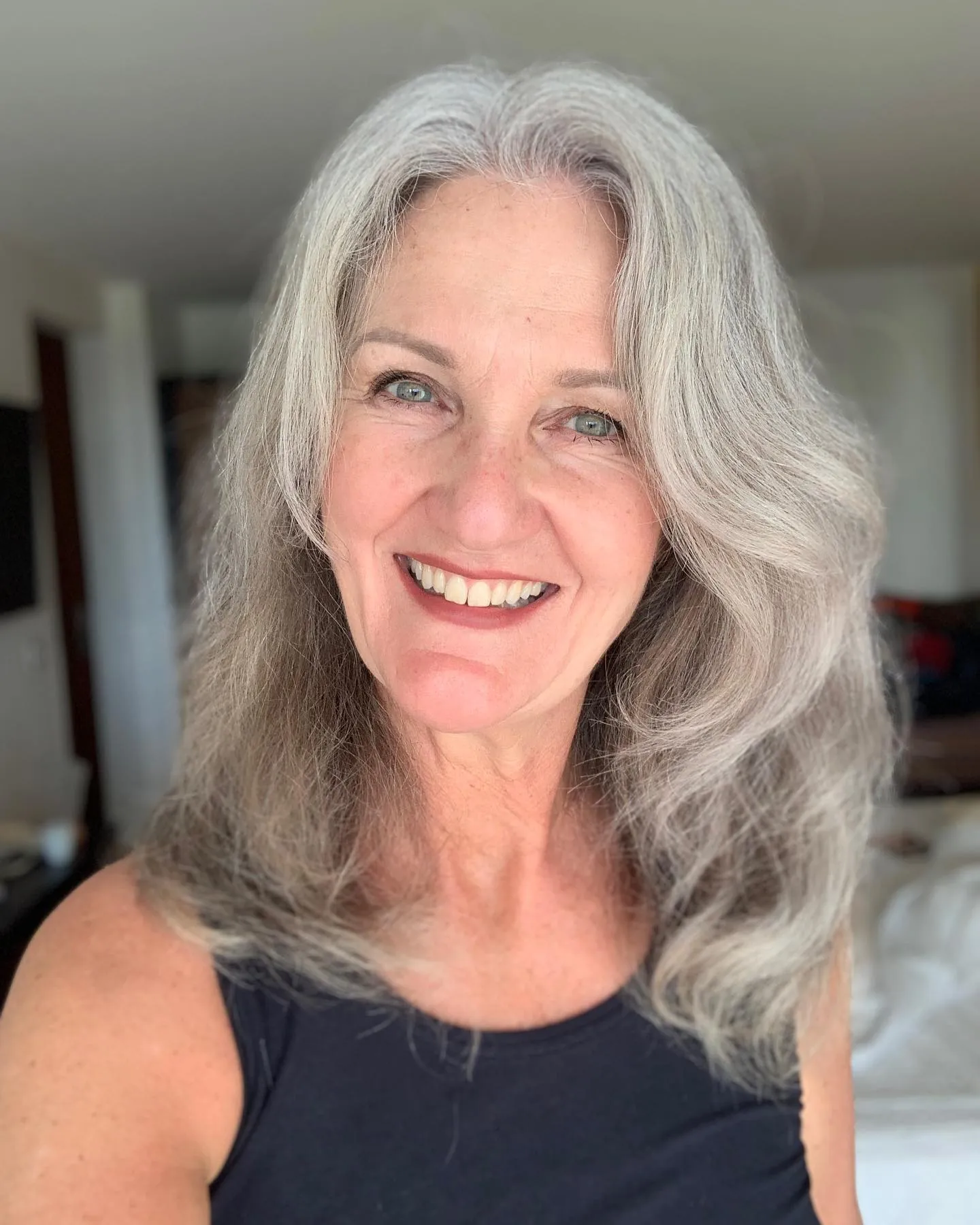 Shoulder-length silver hair with face-framing layers