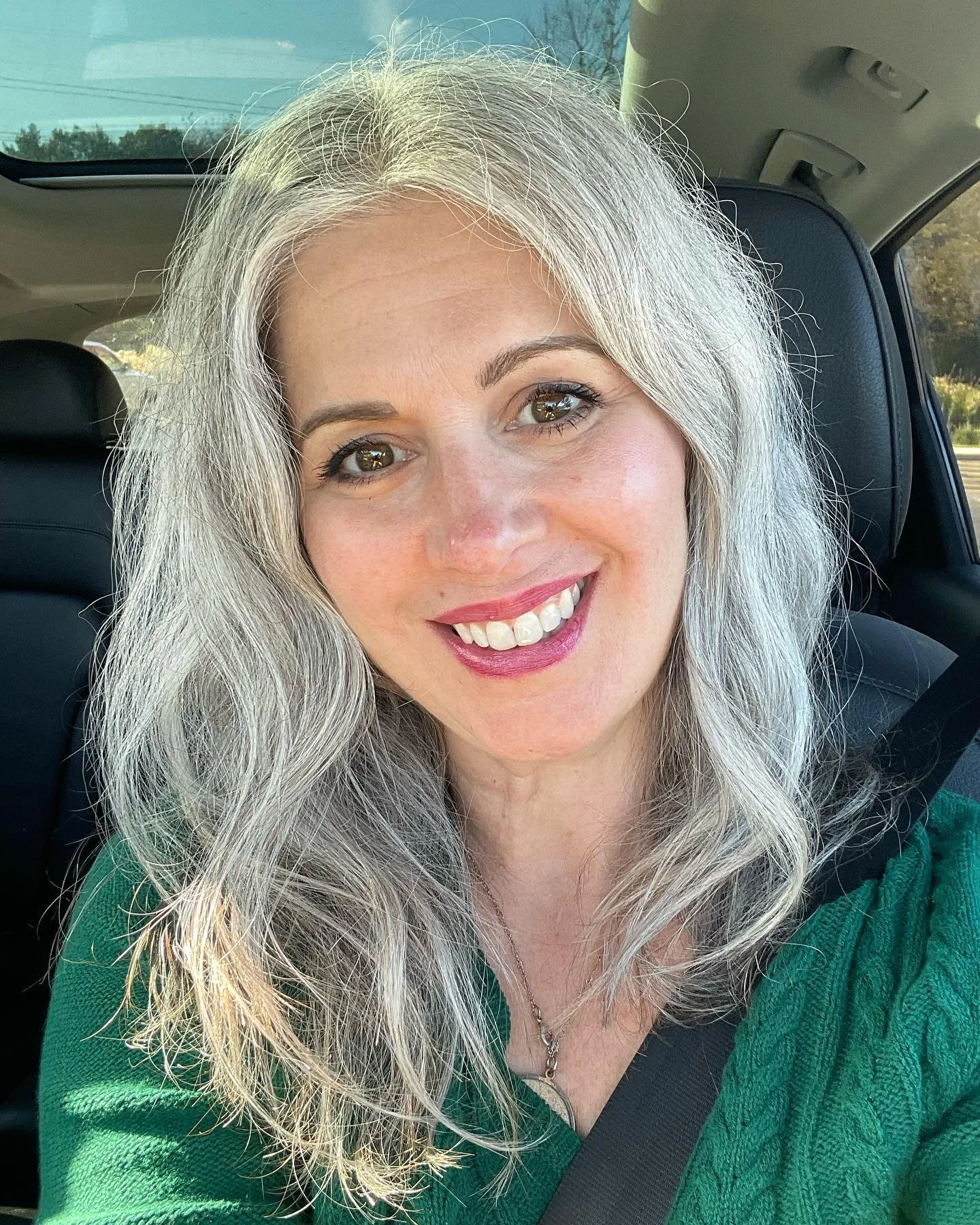 Long silver hair with center-parted soft waves