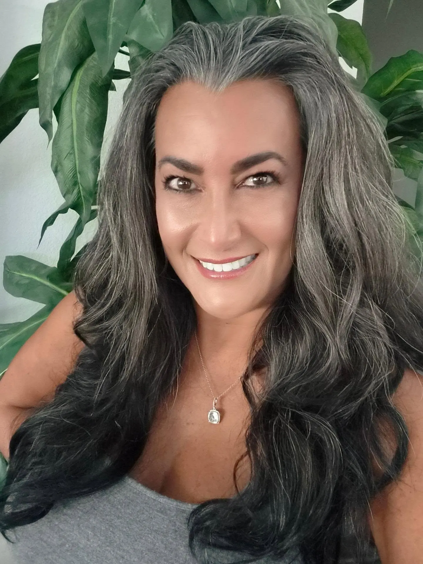 Long dark and silver hair with full waves