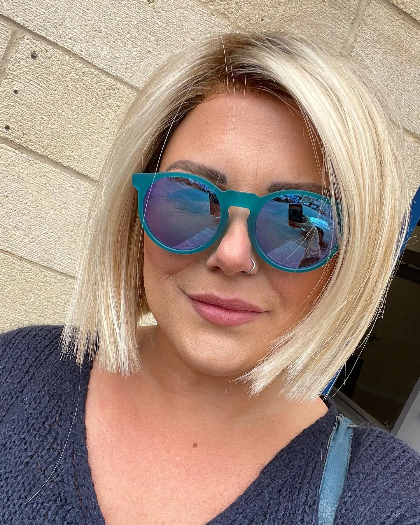 Blunt blonde bob with clean jaw length edge