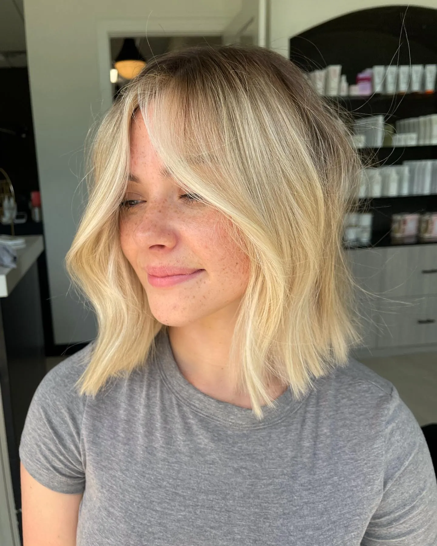 Layered blonde bob with centre part