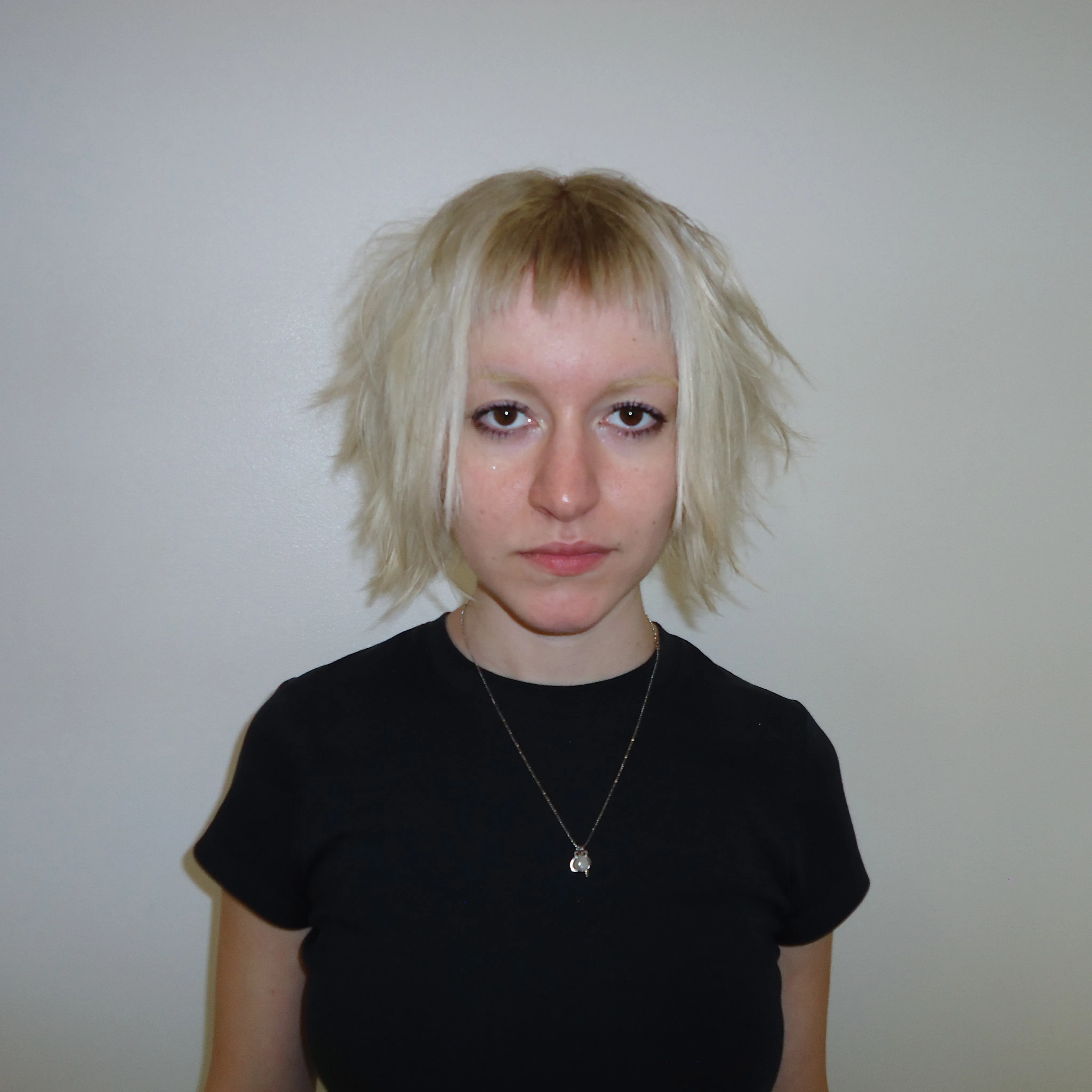 Choppy pale blonde crop with micro fringe