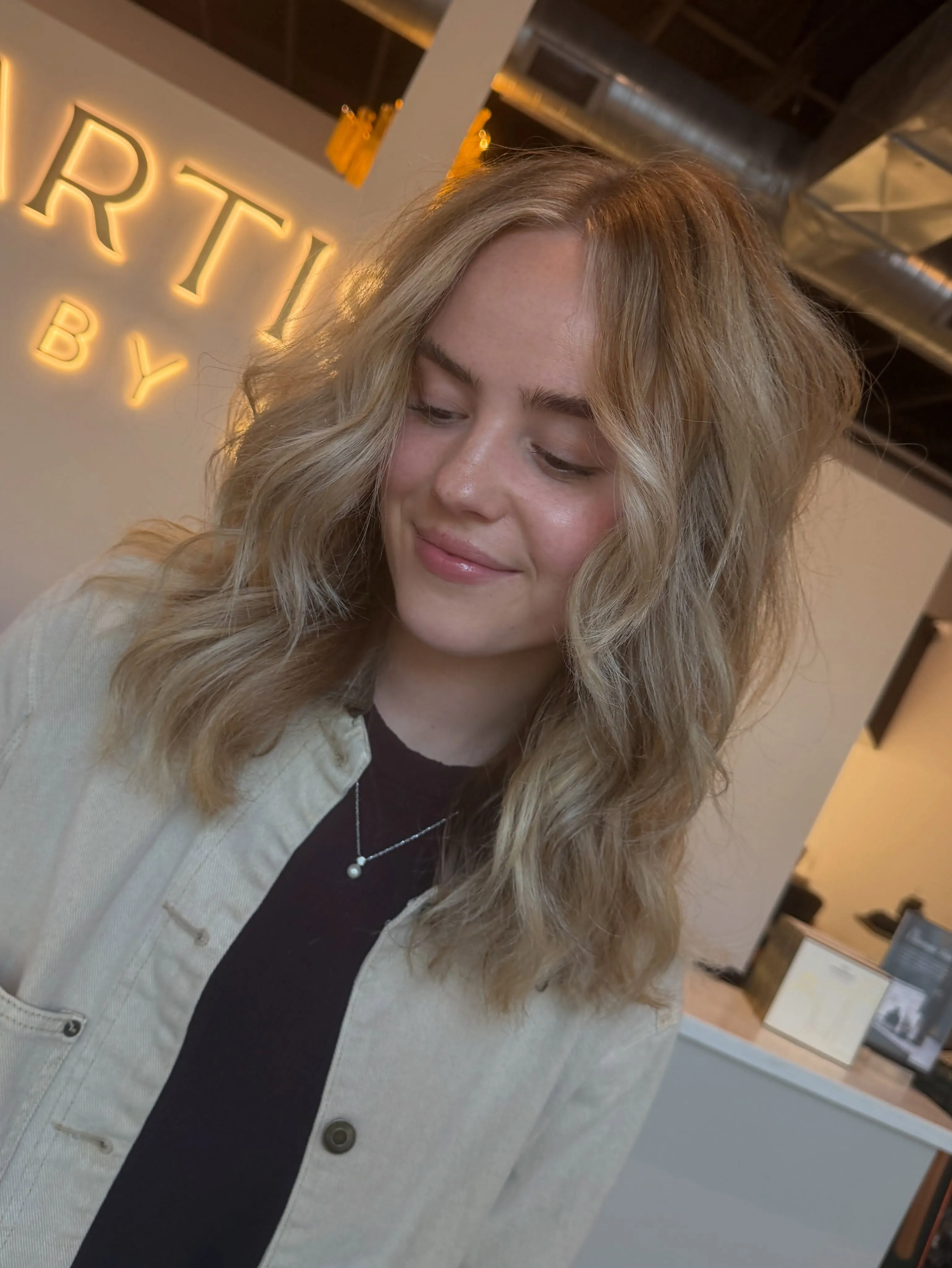 Tousled medium blonde hair with soft layers
