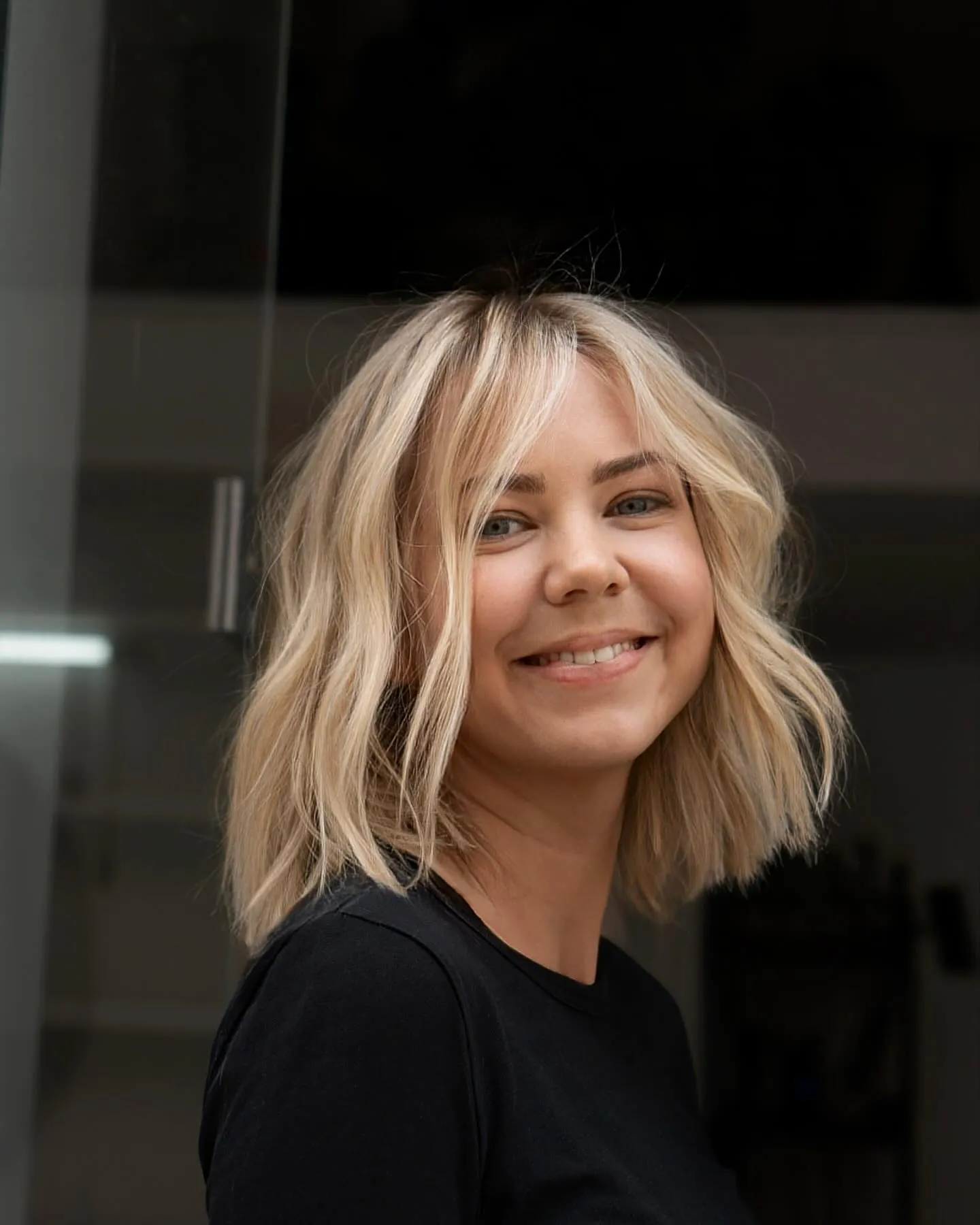 Piecey blonde bob with darker root