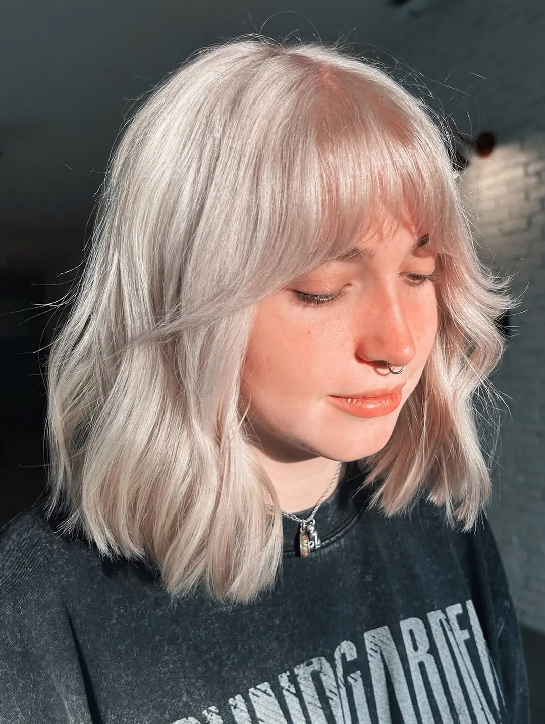 Silver blonde lob with full airy fringe