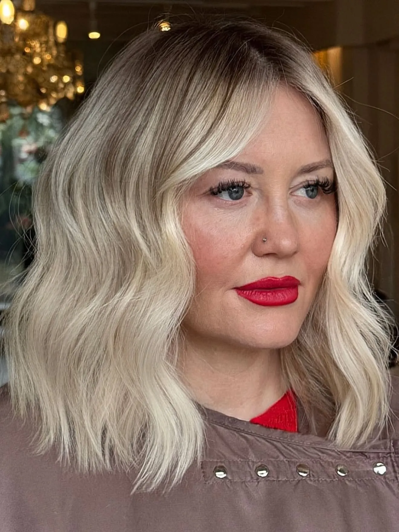 Pale blonde bob with darker rooted centre part
