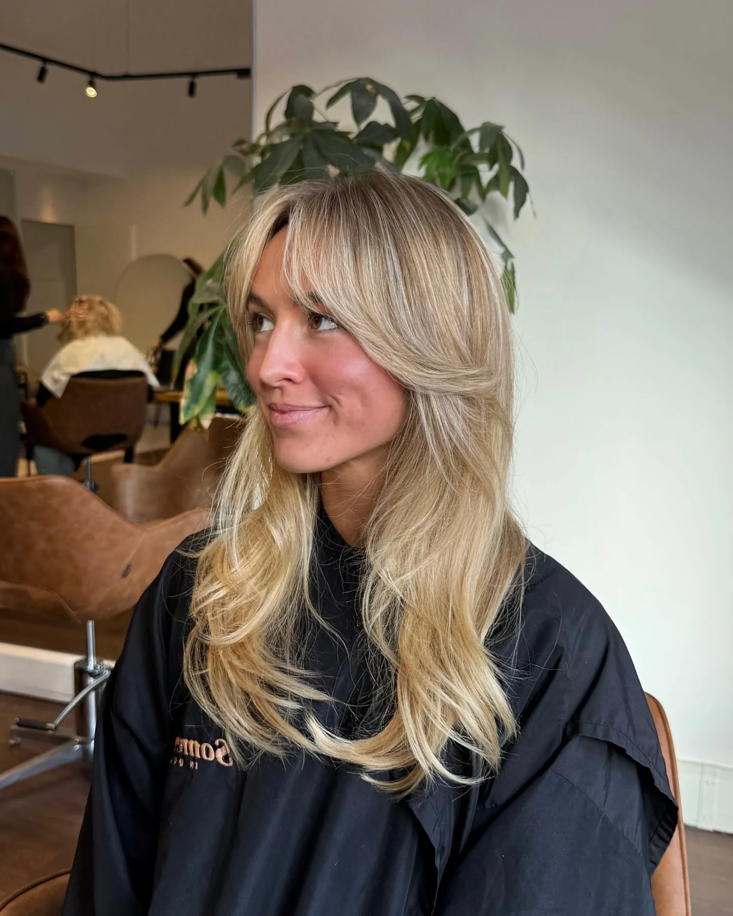 Long blonde layers with curtain fringe