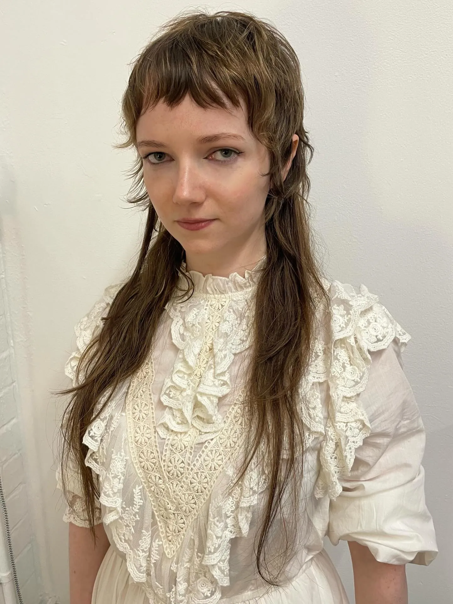 Long hair with very short fringe and loose Victorian-inspired waves