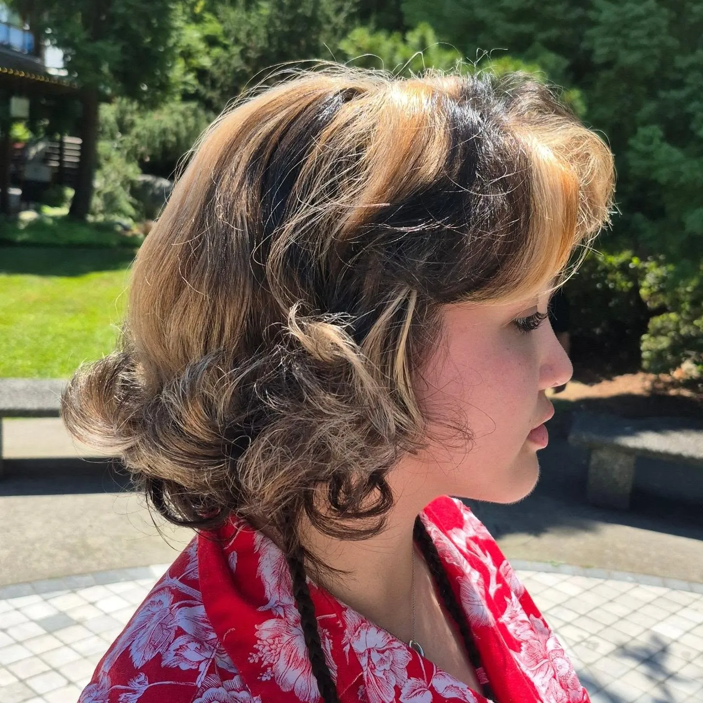 Short pinned curls arranged around the nape and sides
