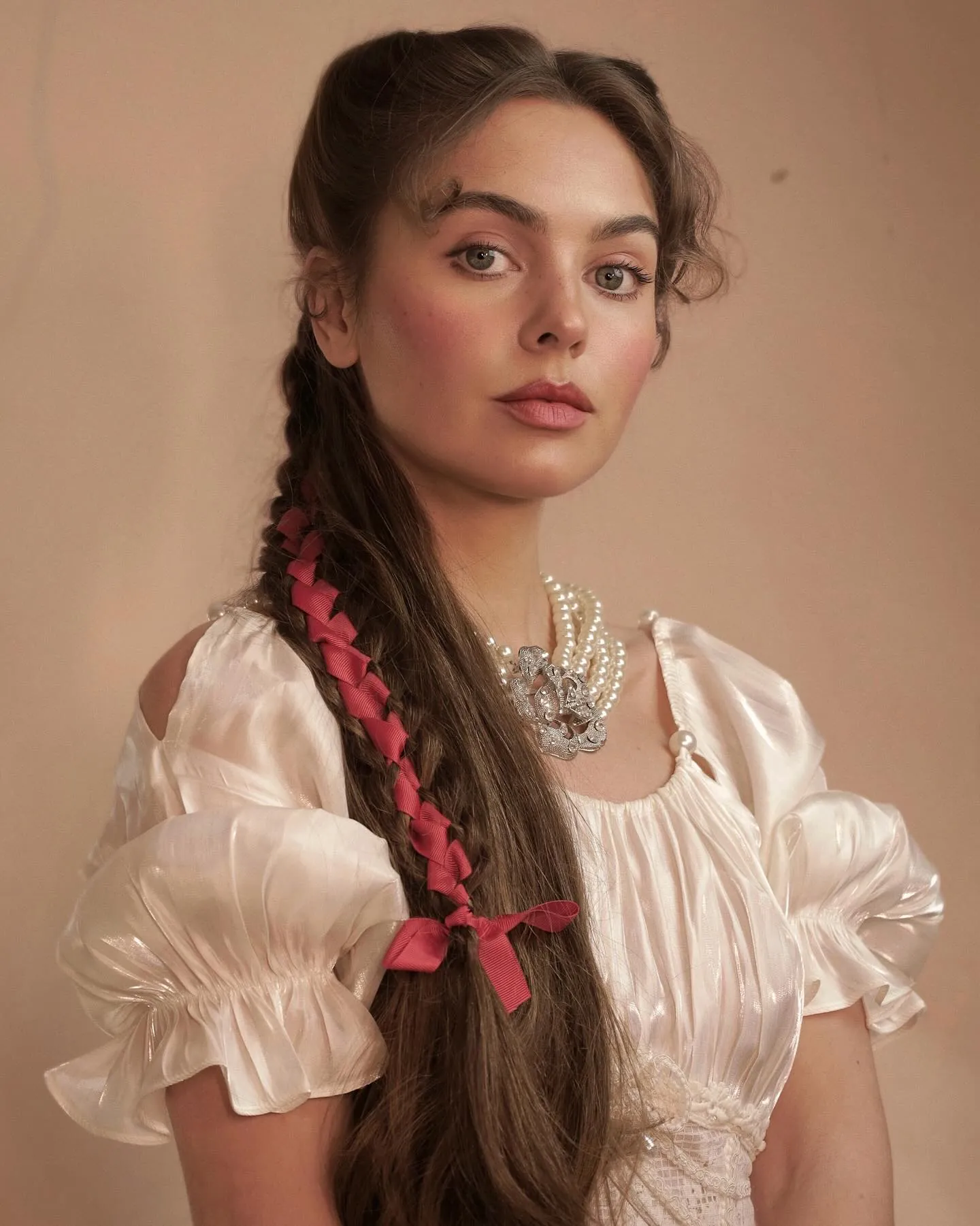 Long Victorian braid wrapped with a red ribbon