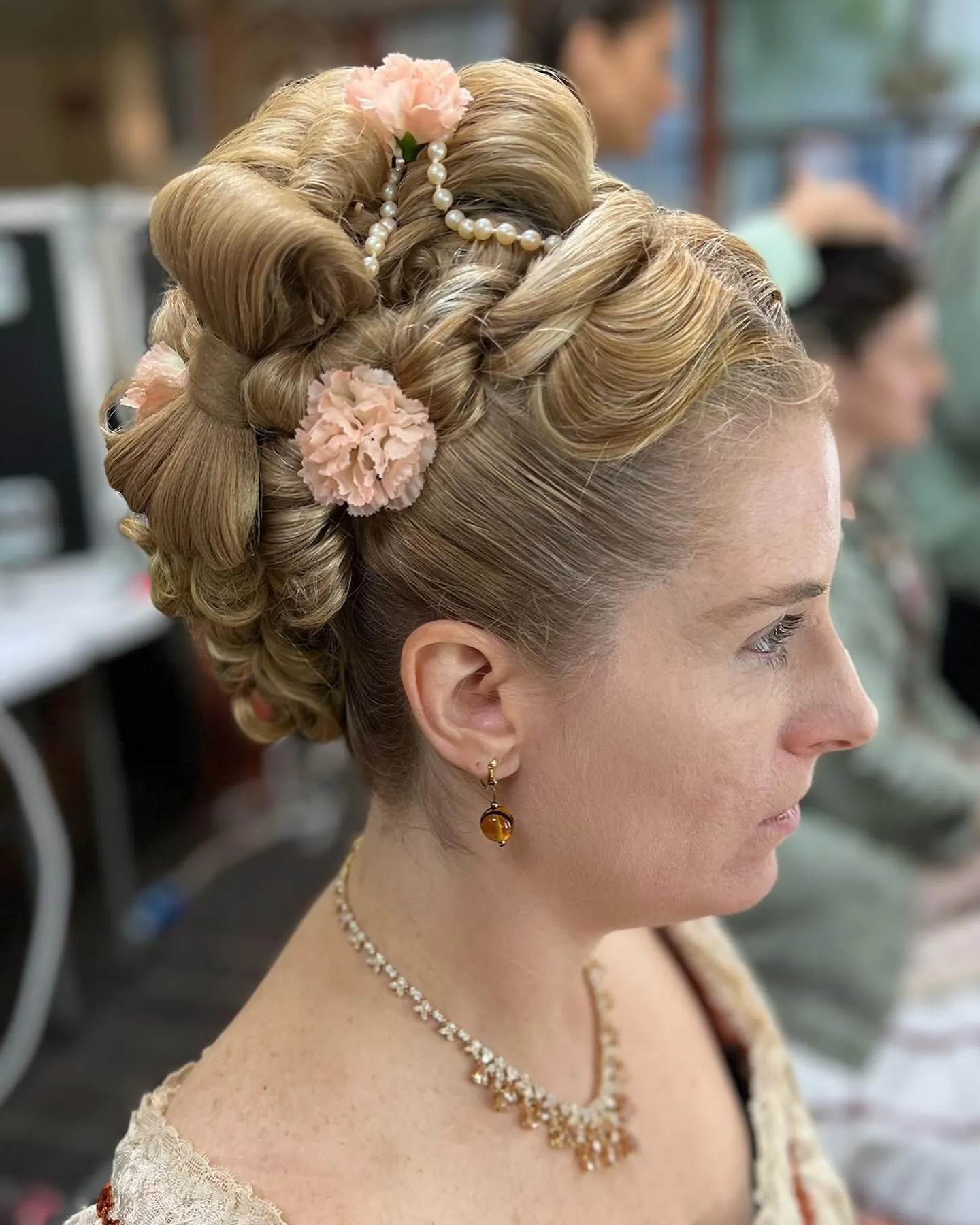 Victorian braided updo decorated with small flowers
