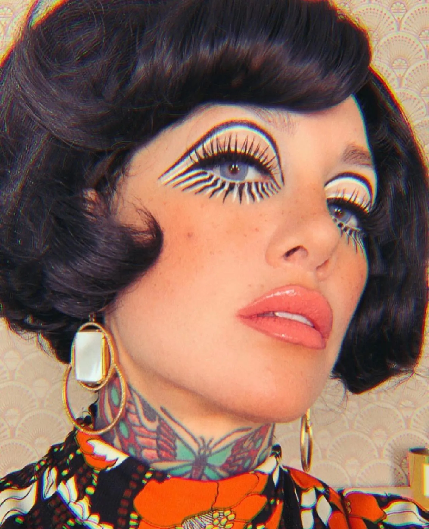 Dark geometric bob with heavy curved fringe and sculpted sides