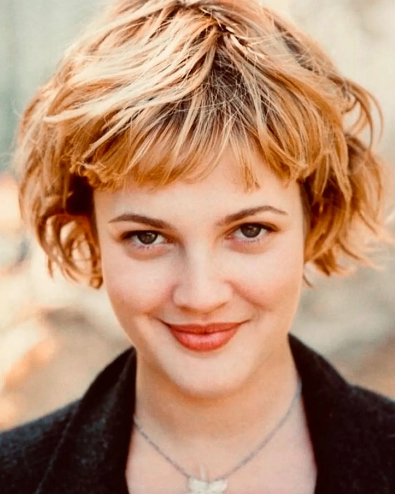 Short tousled vintage crop with tiny fringe and curled side pieces