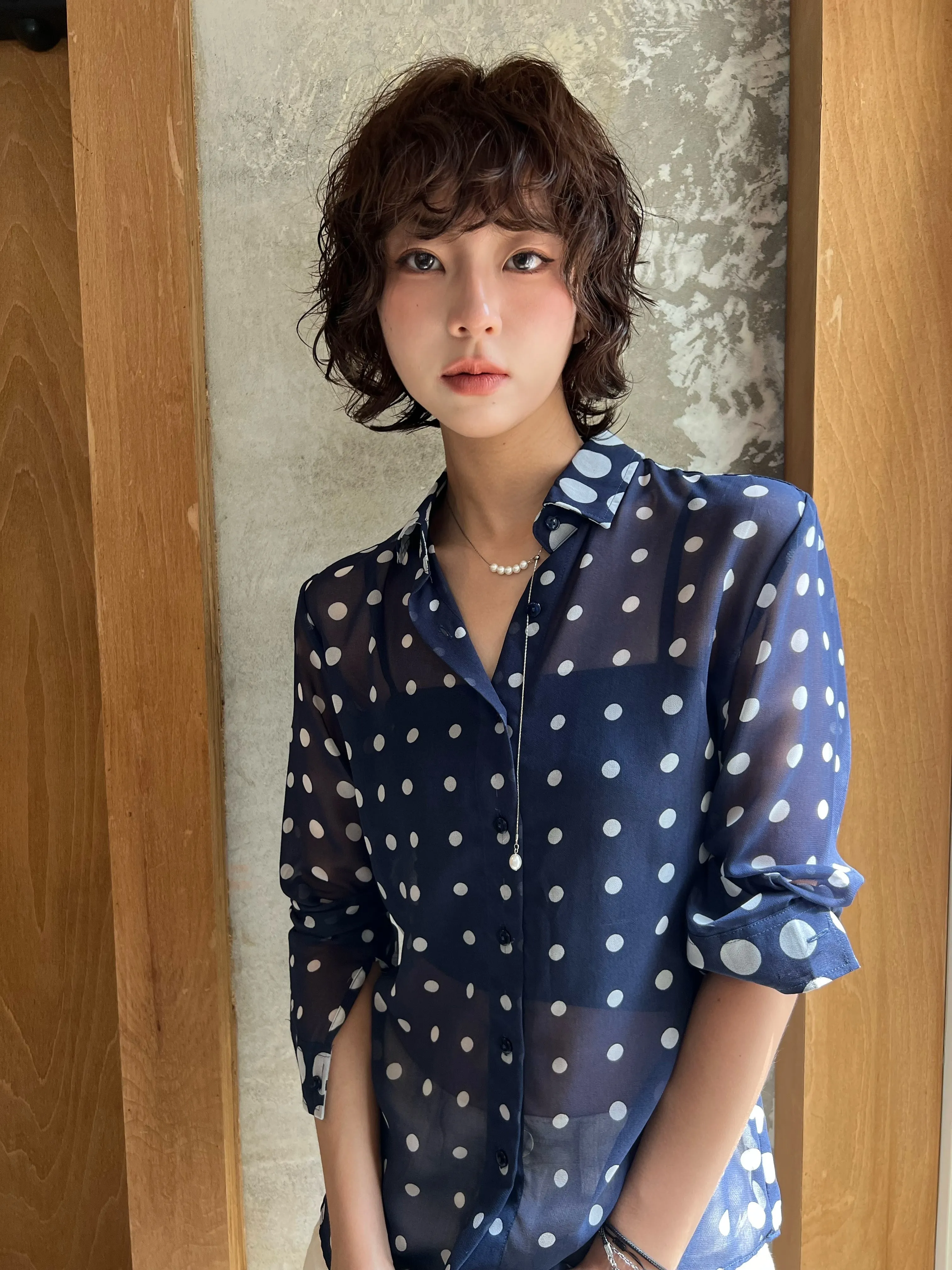 Short rounded bob with soft waves and full fringe