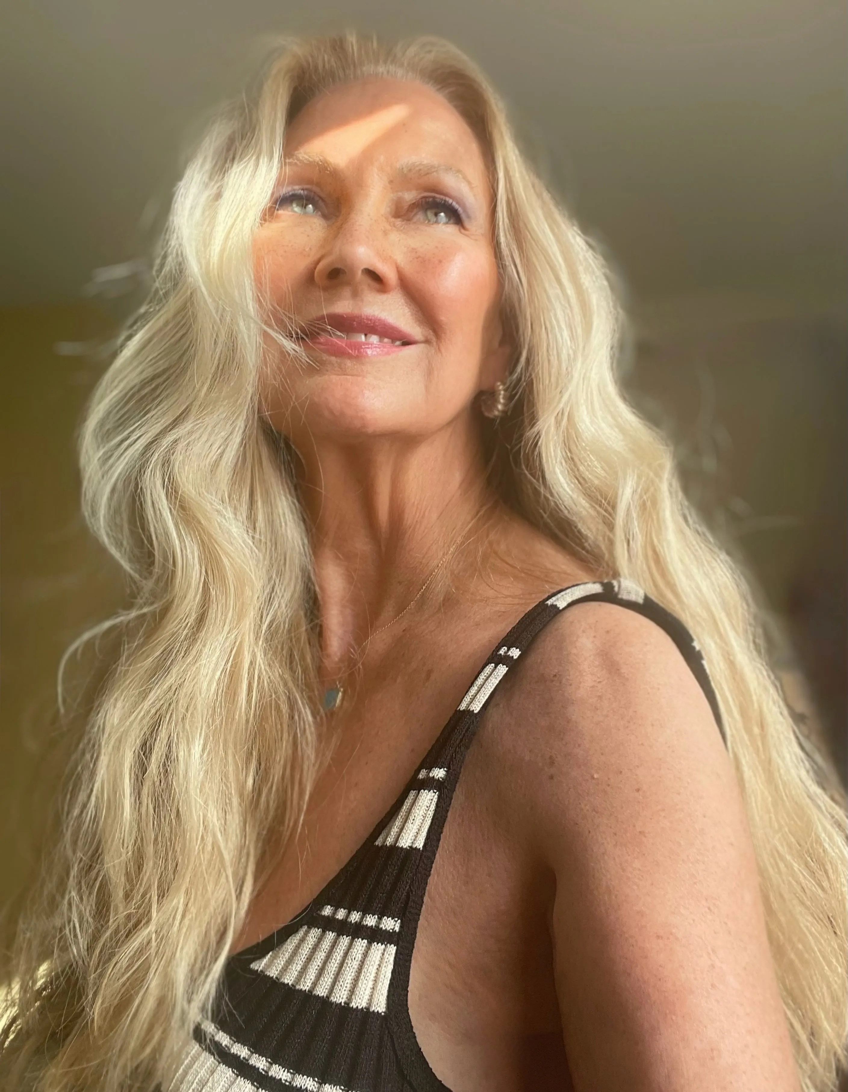 Long loose blonde waves with a center part