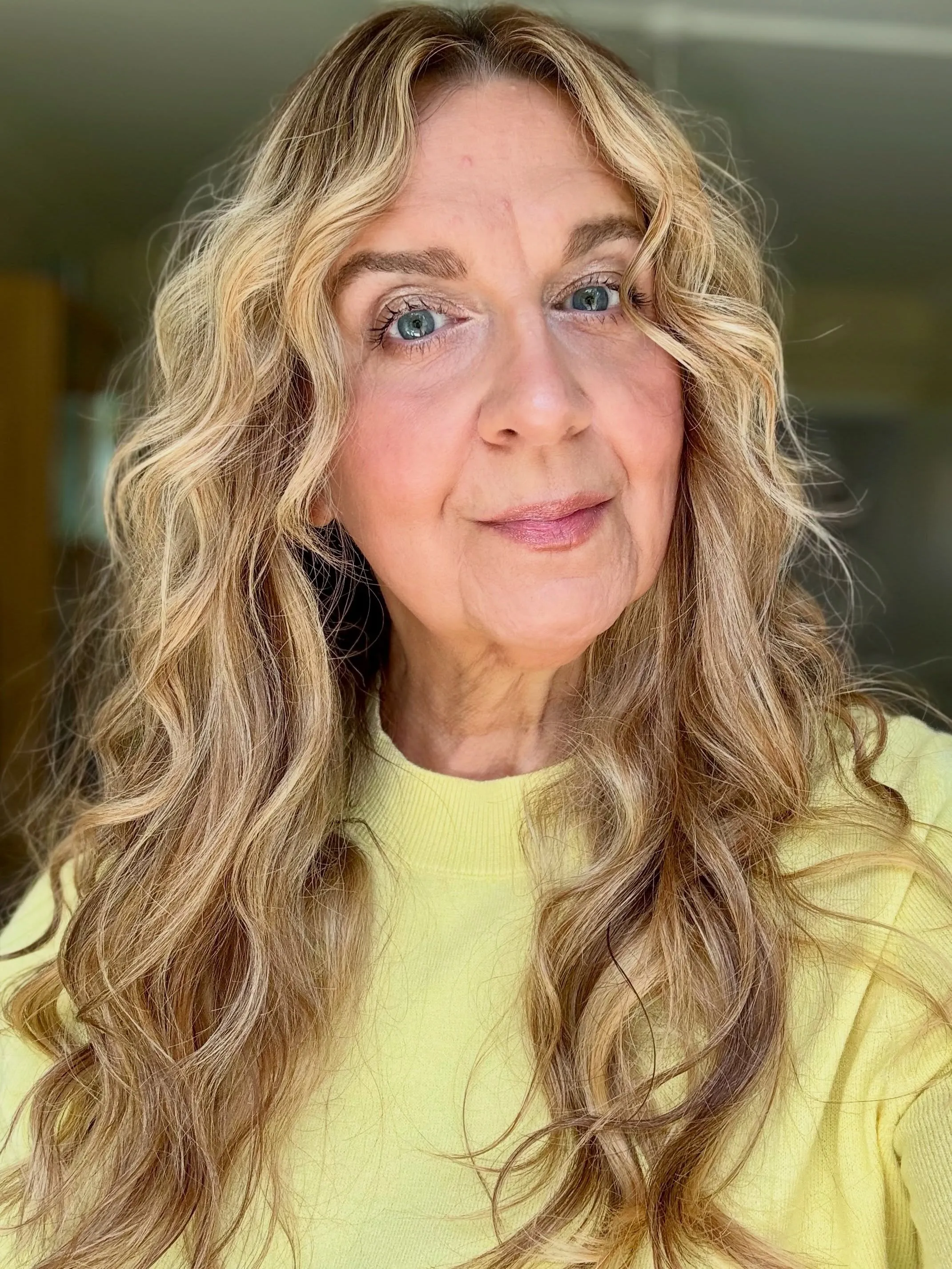 Long blonde waves with face-framing layers
