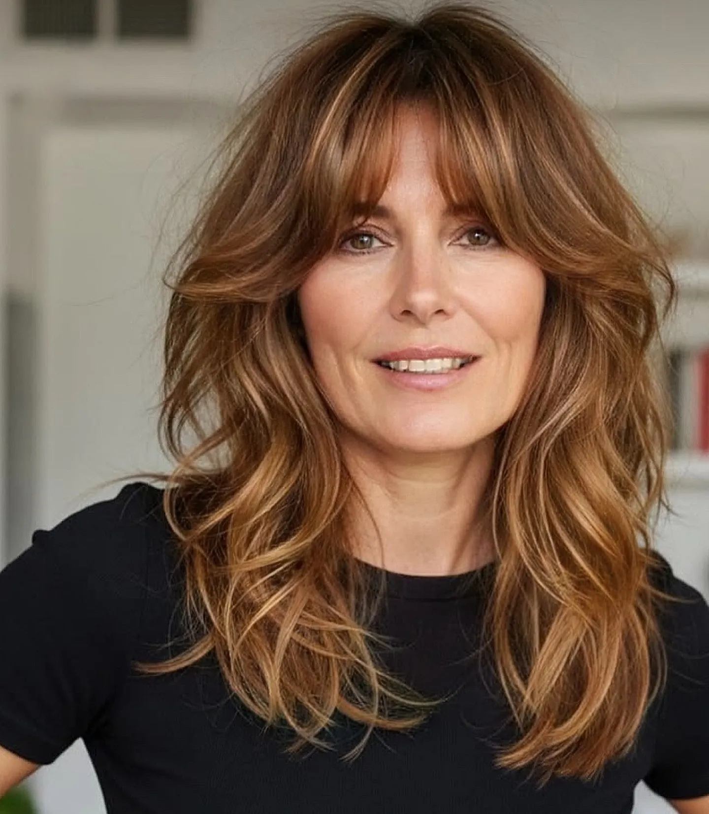 Long wavy layers with full parted bangs