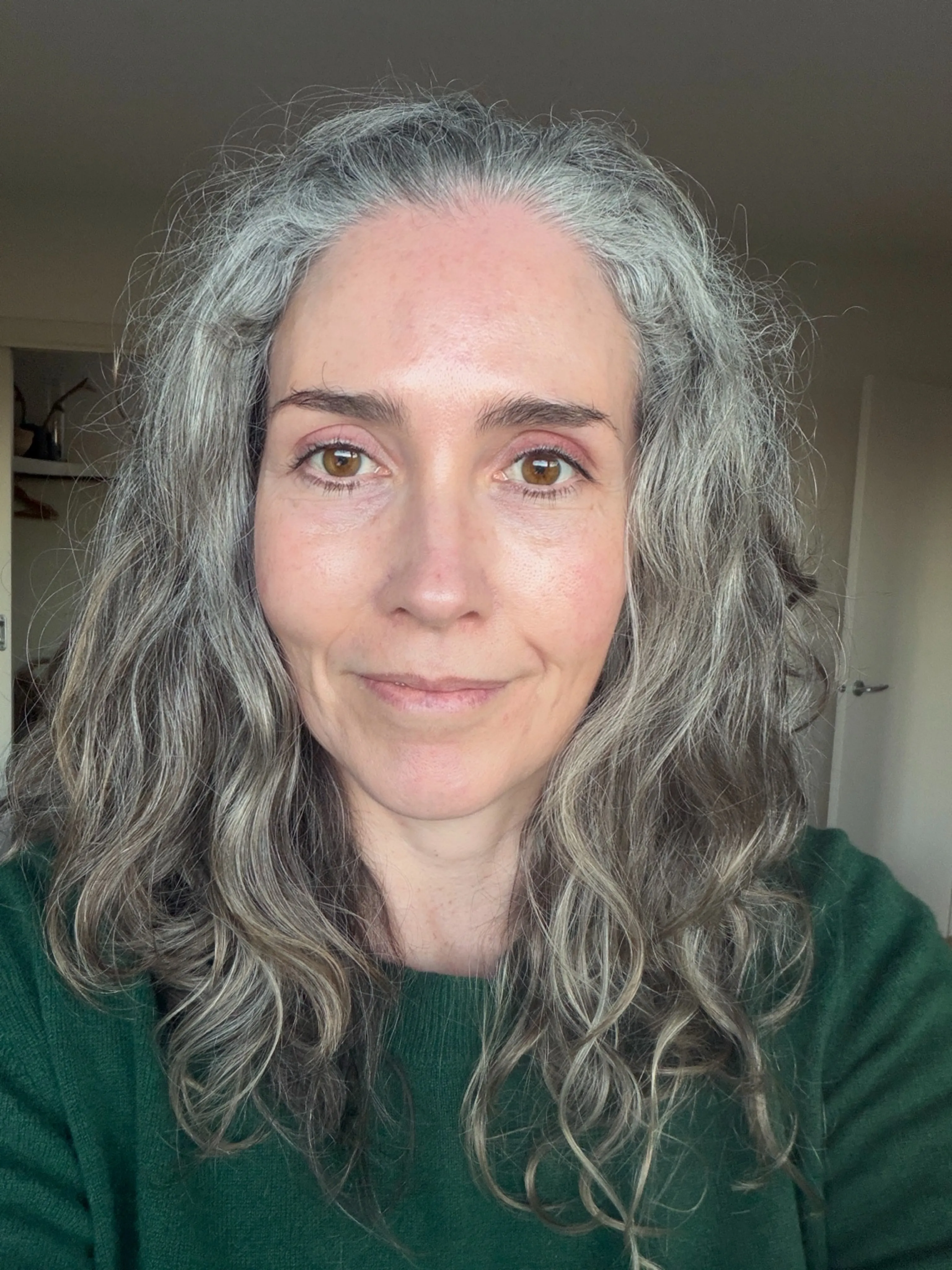 Long natural gray waves with a center part