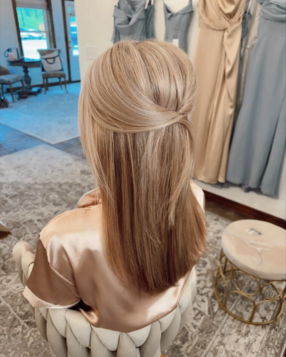 Straight medium-length hair with a wrapped half-up section