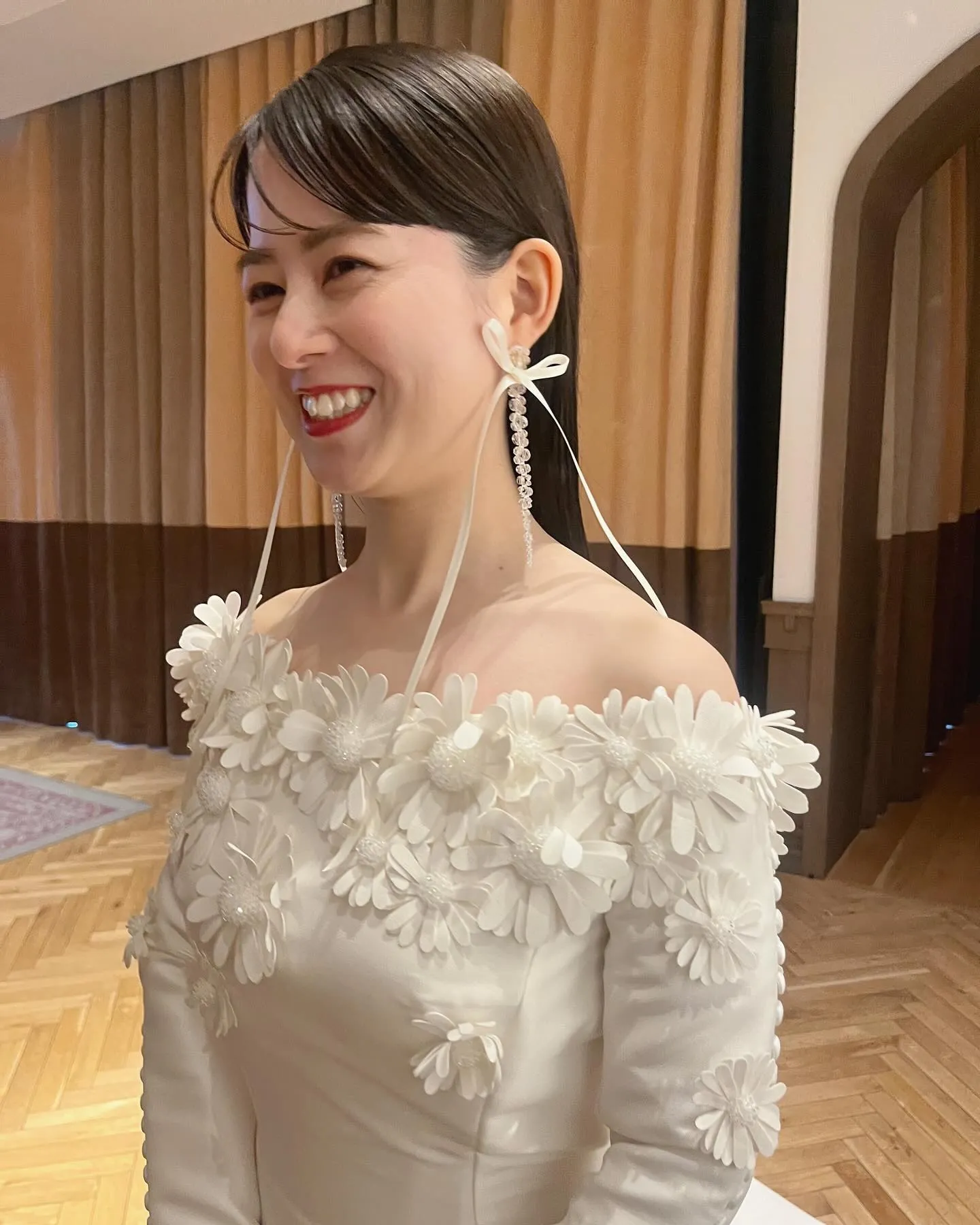 Sleek straight wedding hair with side-swept fringe