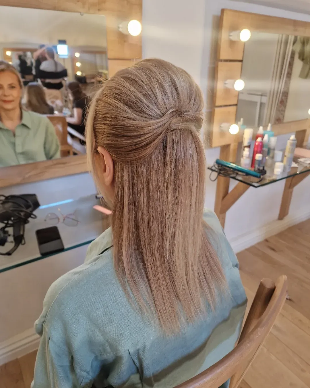 Straight medium-length hair in a wrapped low ponytail