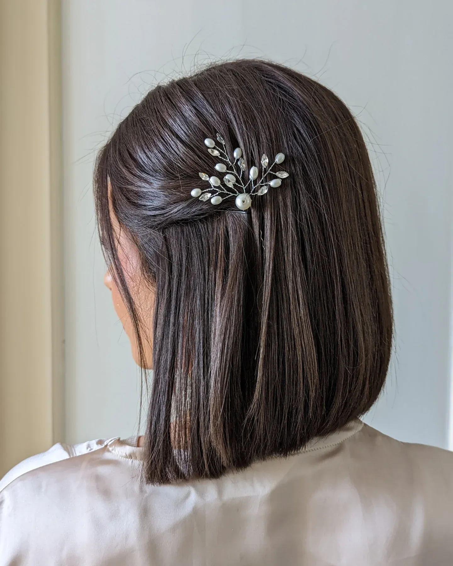 Straight bob with a pearl branch hair pin