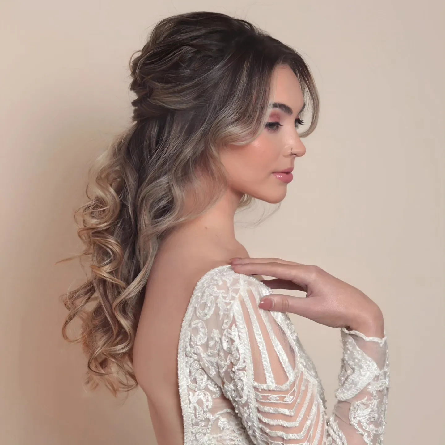 Long half-up bridal hairstyle with full curled lengths
