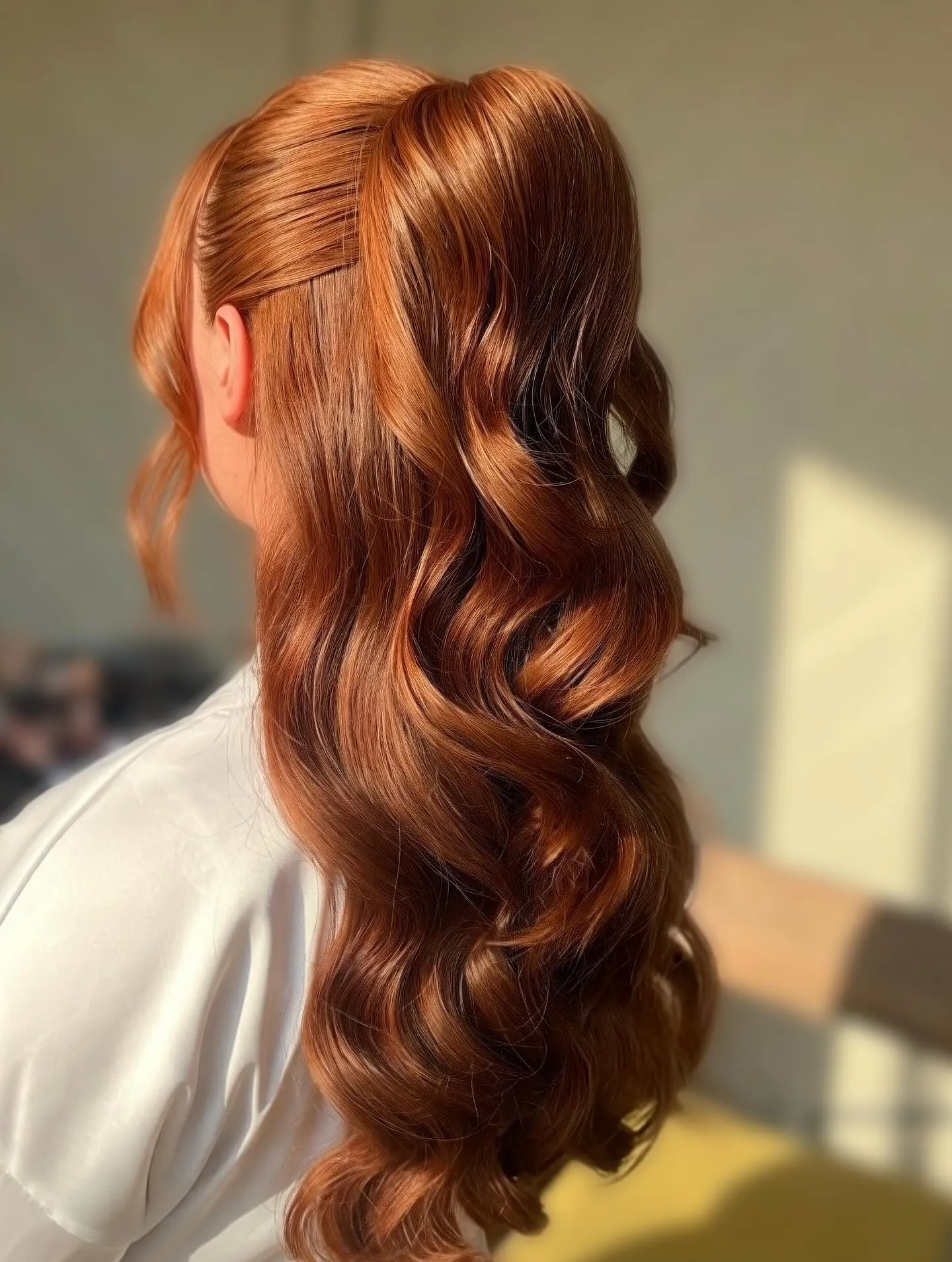 High red ponytail with long sculpted waves