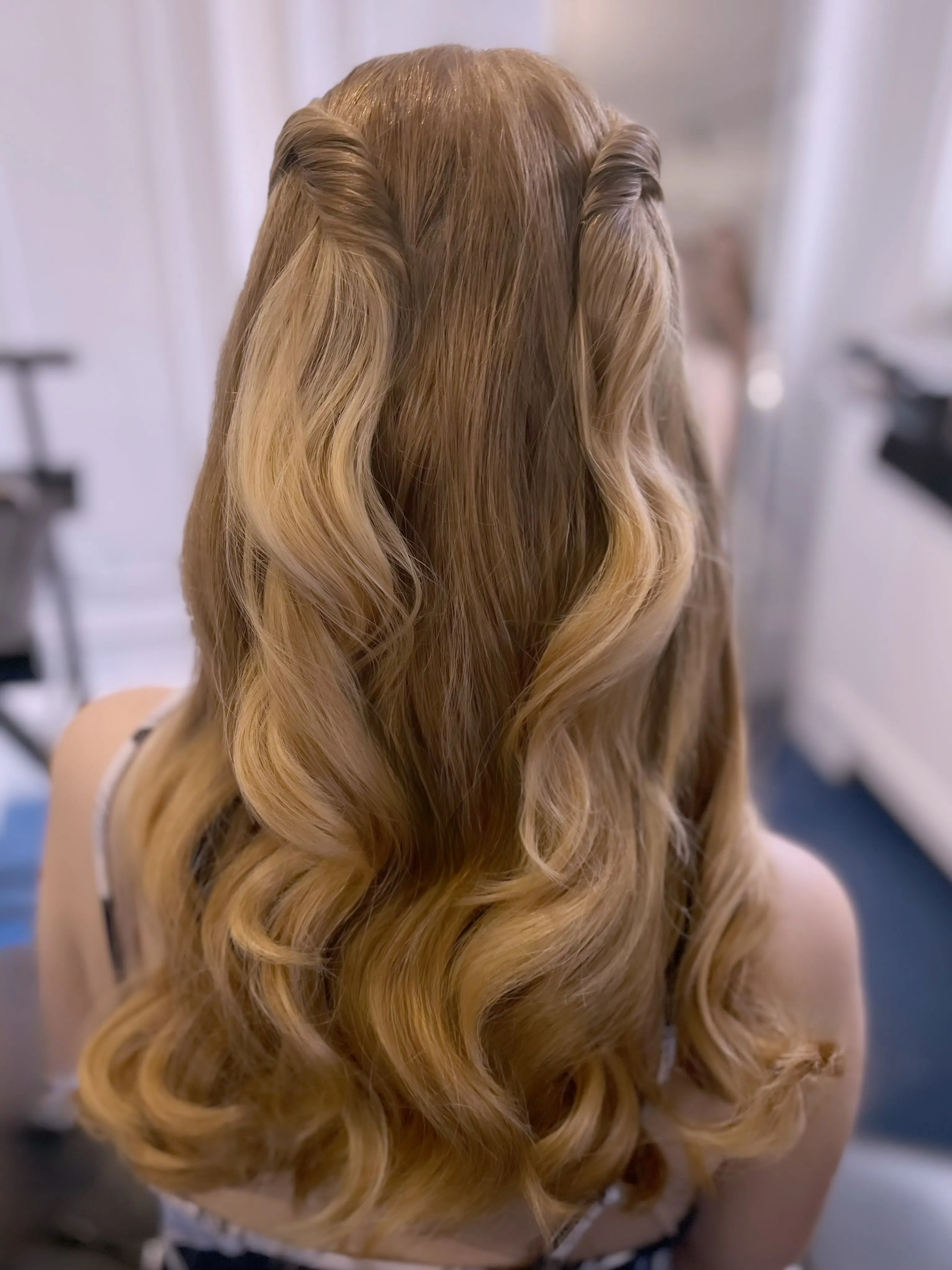 Long blonde waves with twisted half-up side sections