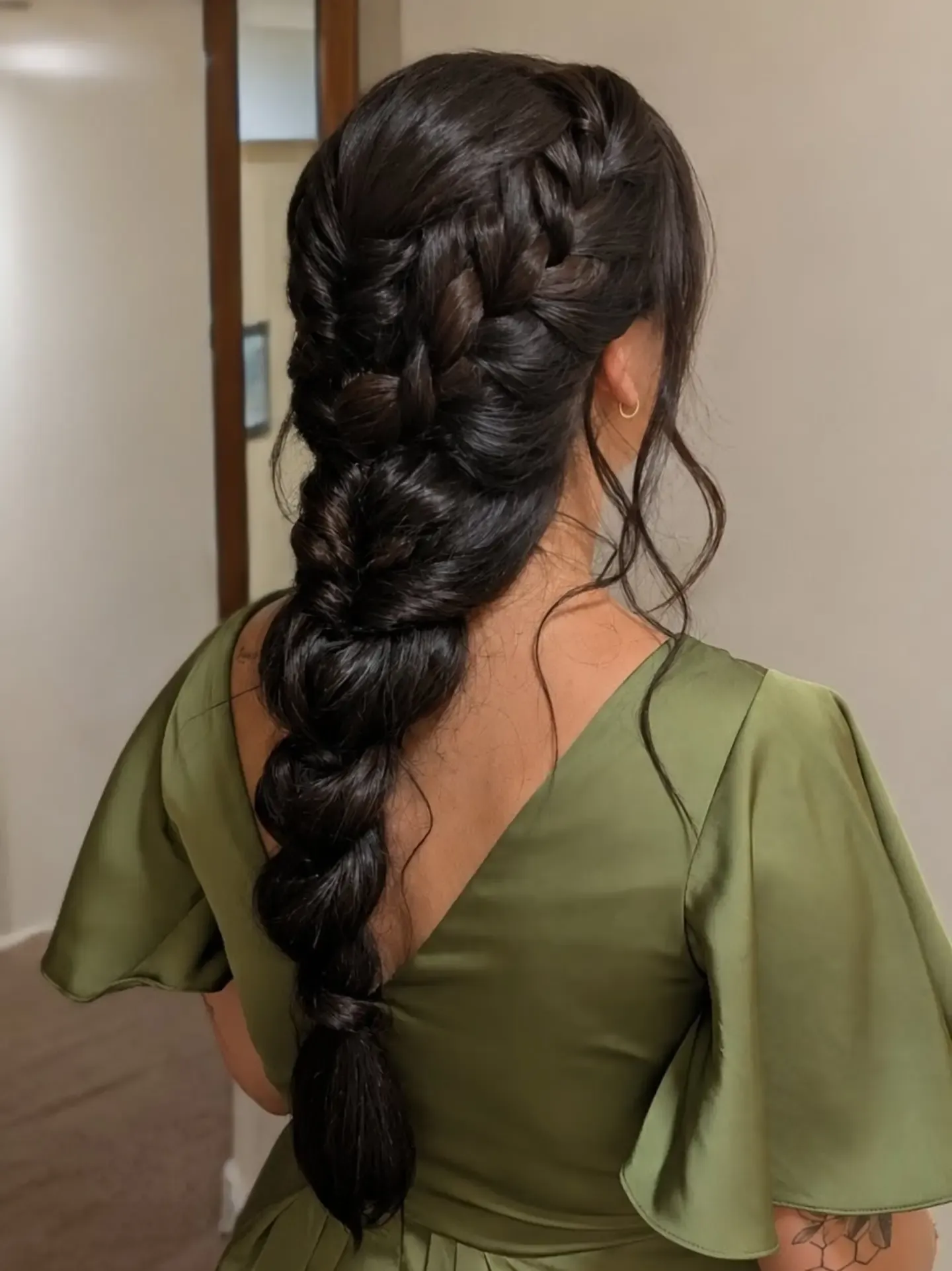 Long dark chunky braid with softly loosened sections