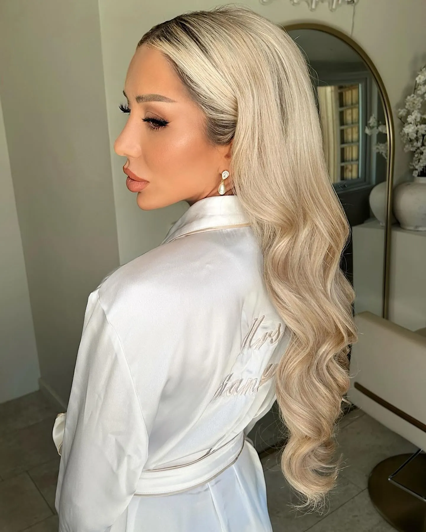 Long blonde hair with soft side-parted bridal waves