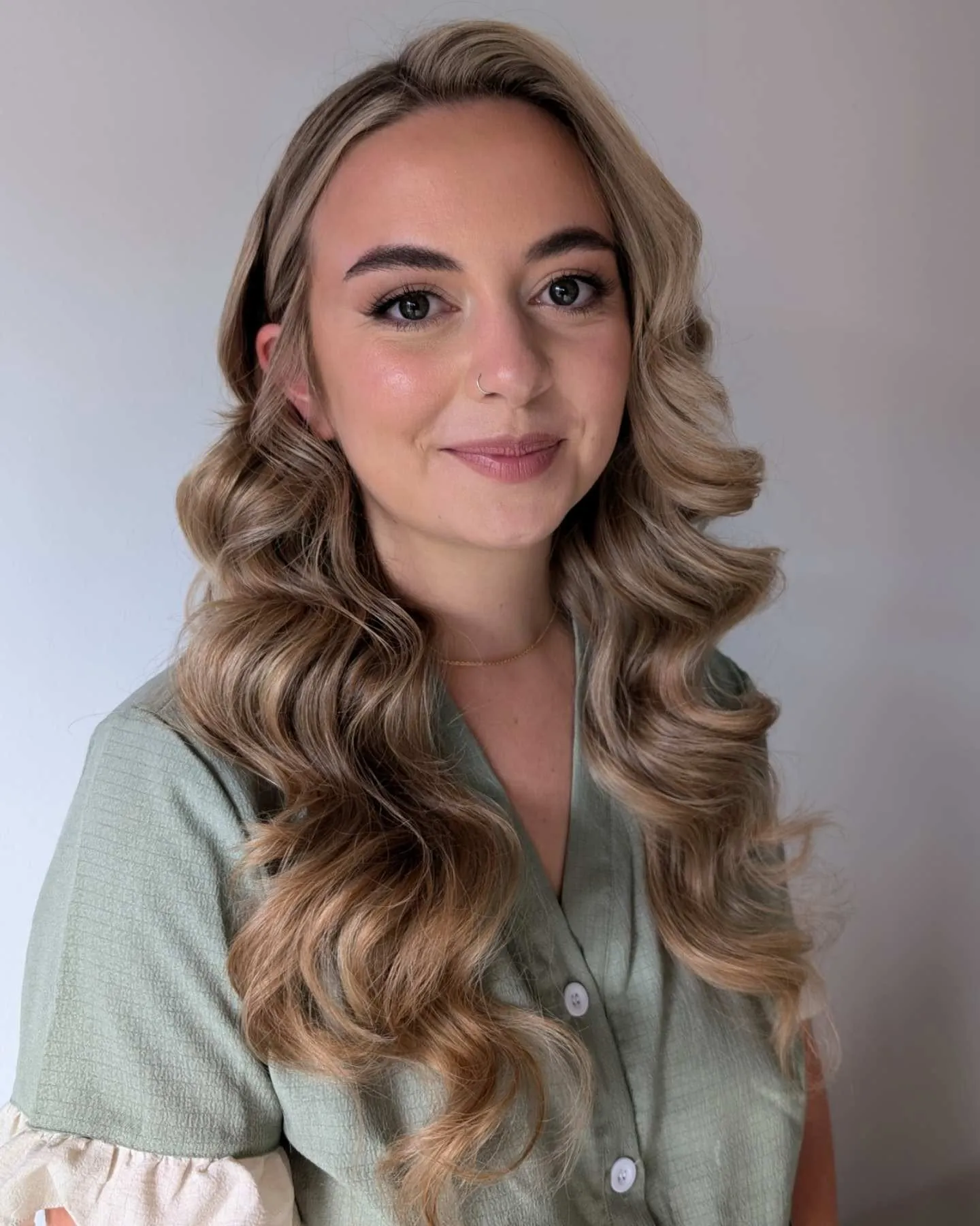 Long highlighted hair with defined polished wedding waves