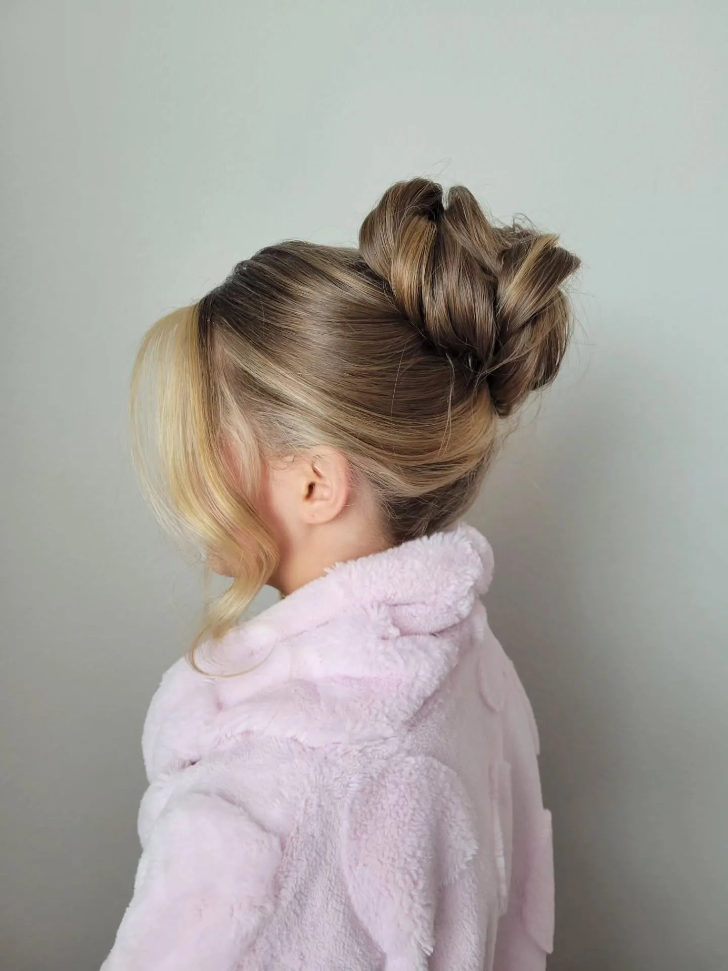 High textured bridal bun with loose front tendrils