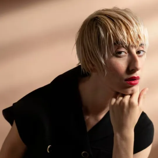 Wispy wet-look pixie with longer fringe pieces