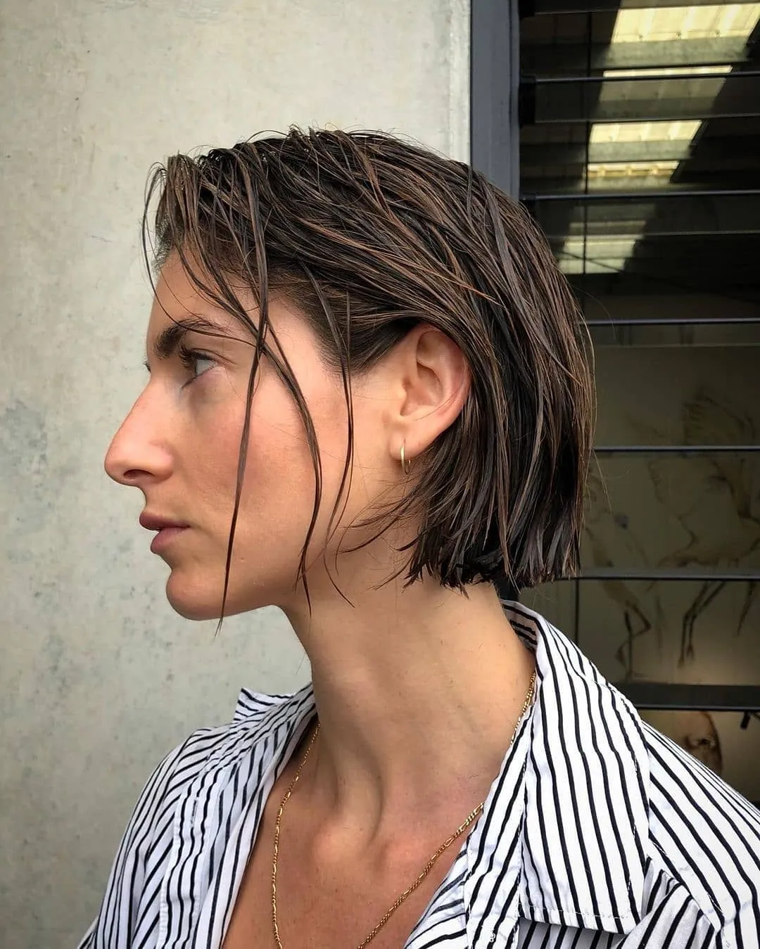 Wet shaggy pixie with longer separated strands