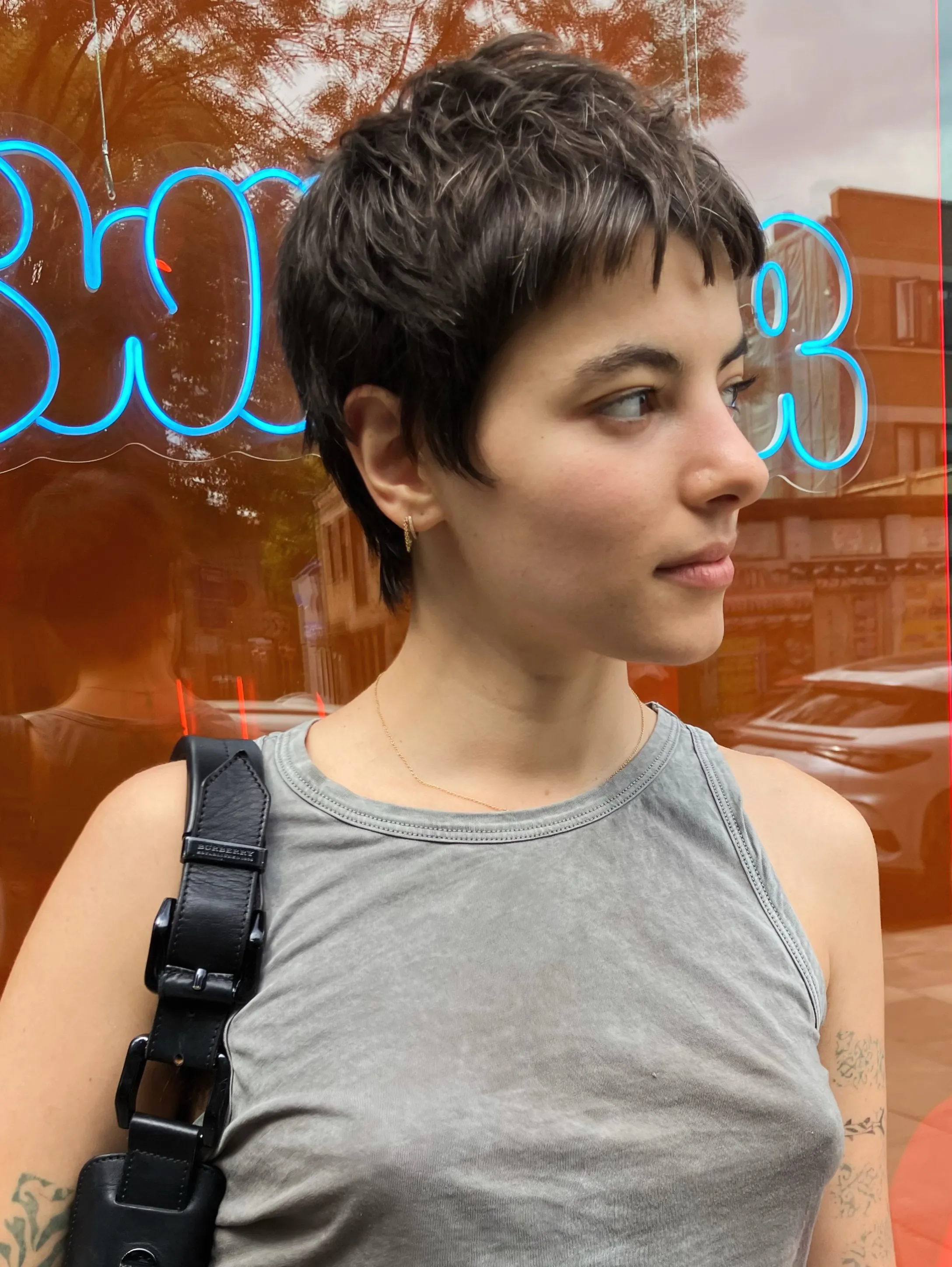 Tousled wet-look pixie with short uneven pieces