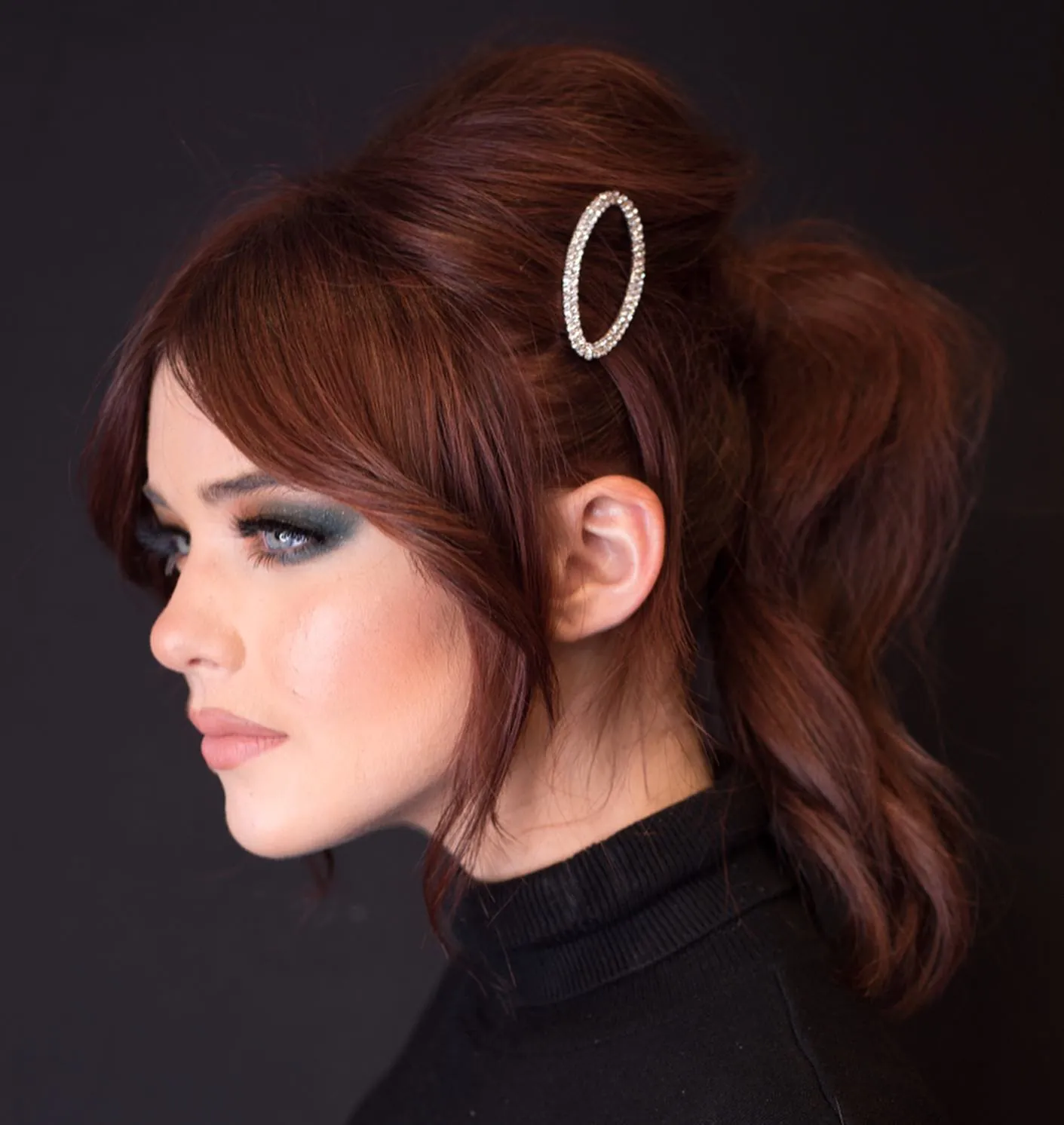 Copper hair in a high ponytail with long side fringe and face-framing pieces