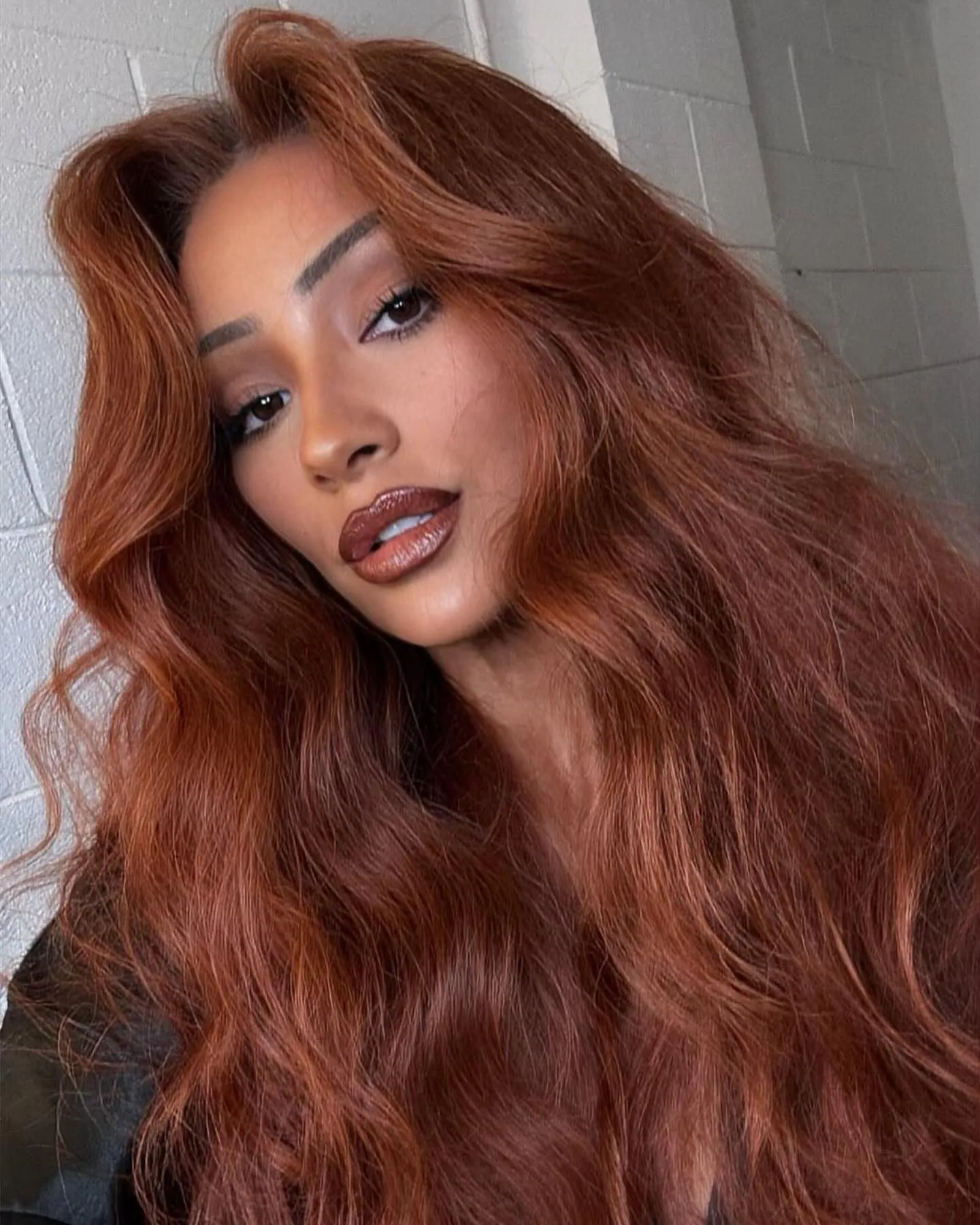 Long copper hair with large voluminous waves and lifted roots