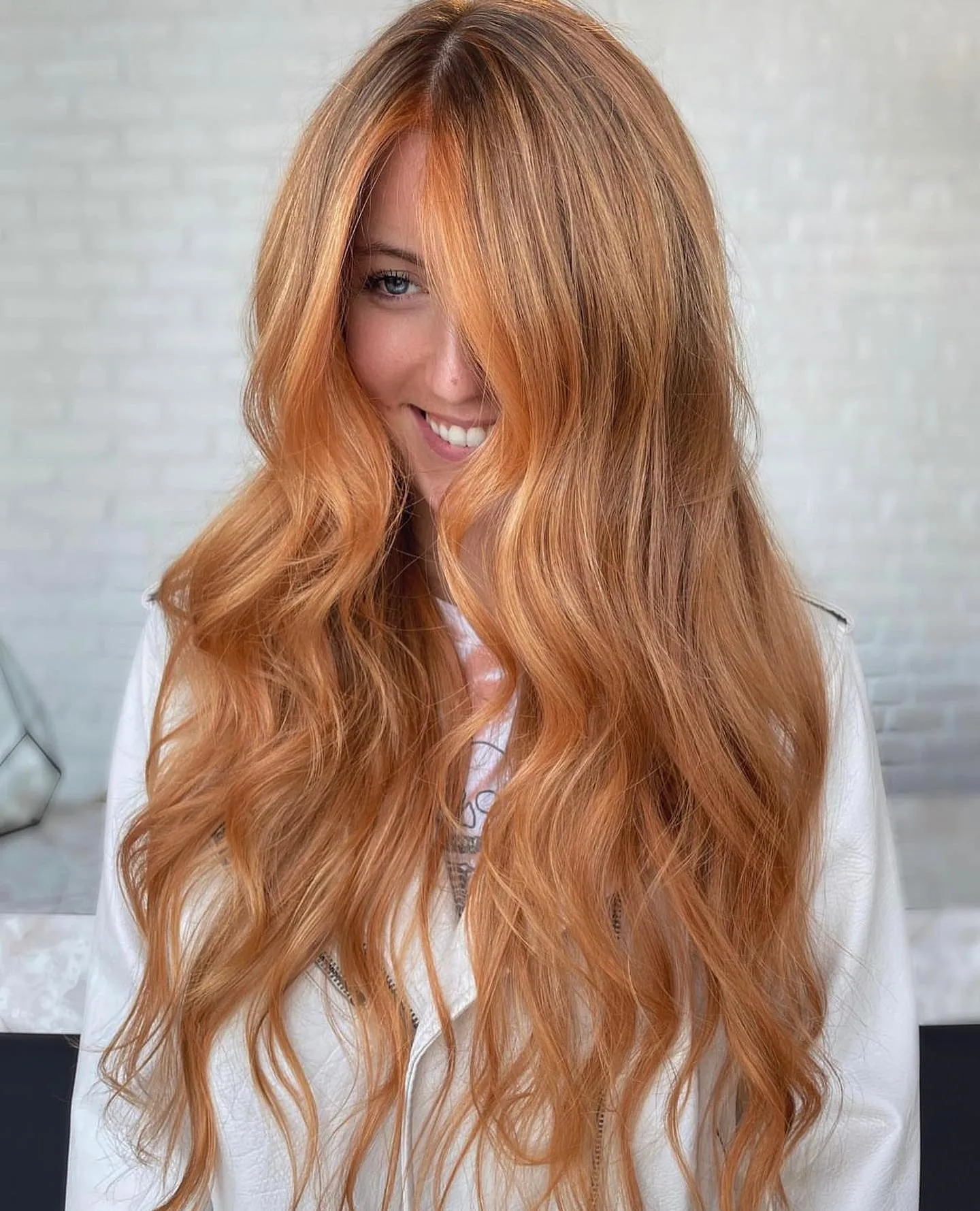 Extra-long light copper hair with cascading loose waves